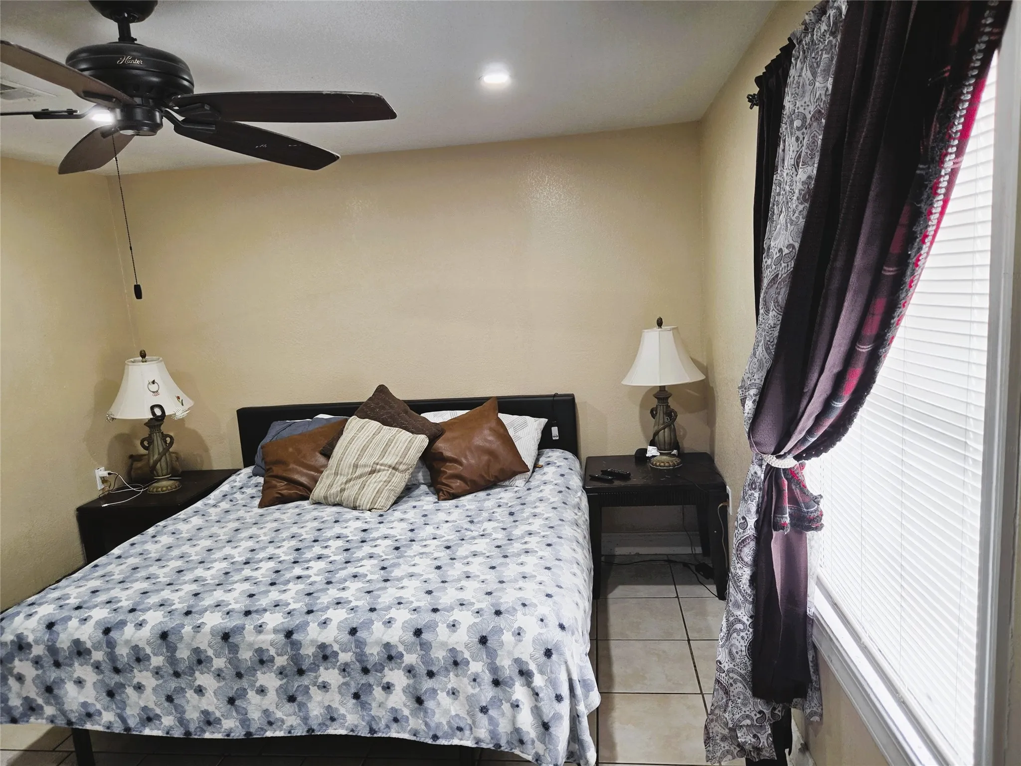 Neutral-toned walls complement the tile flooring
