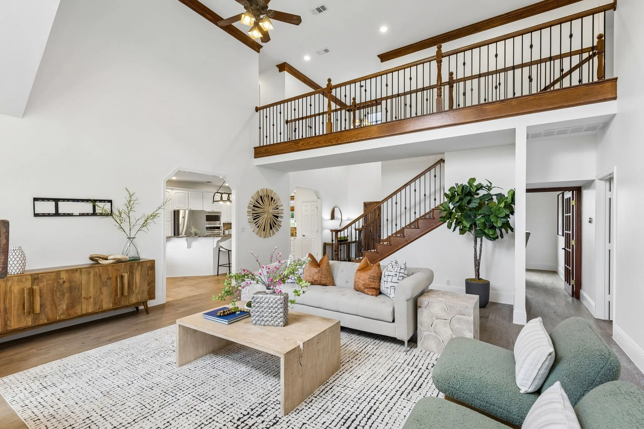 Rich woodwork highlighting two story living room