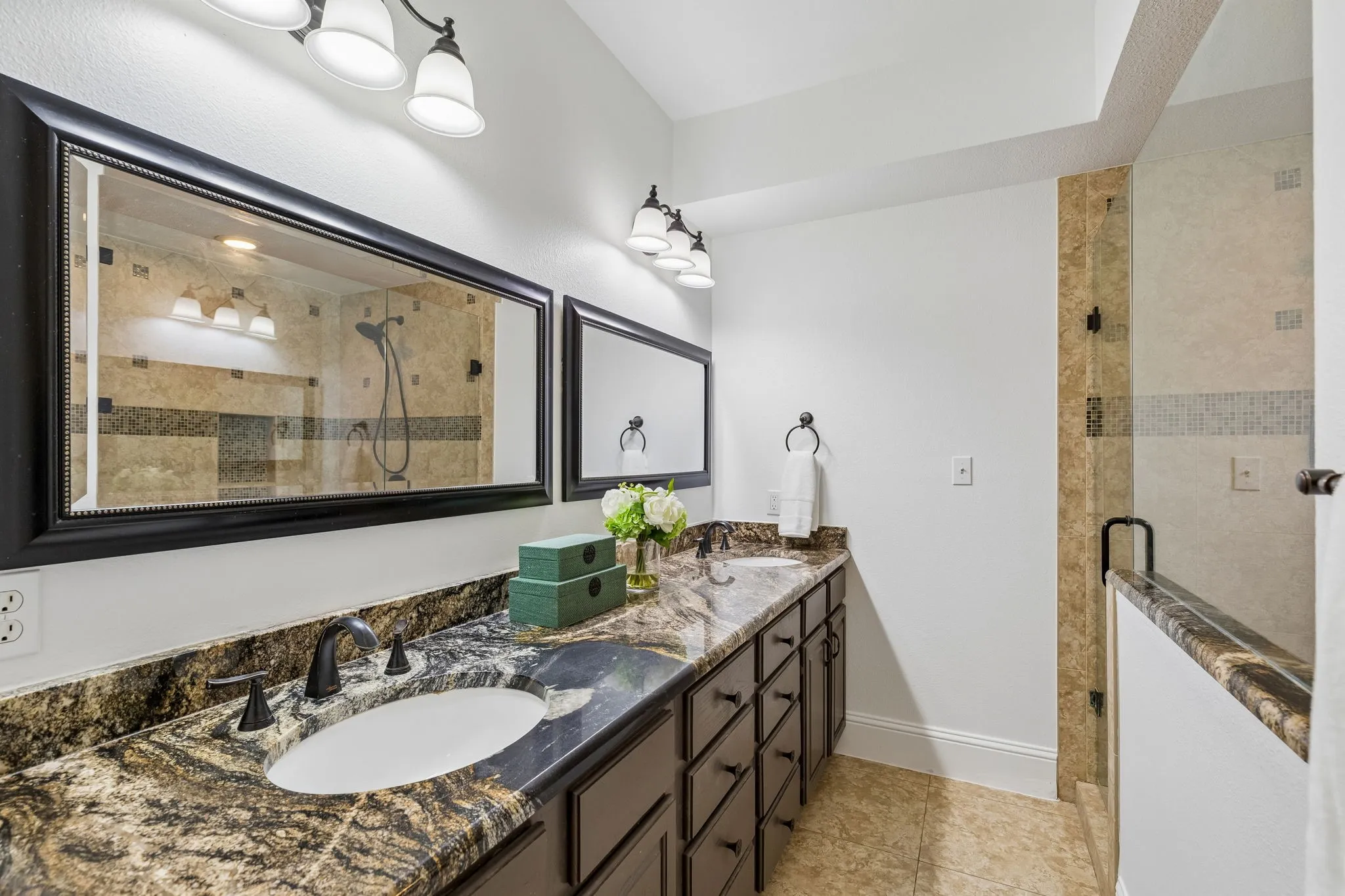 Relax from the day in the spa like primary bathroom with oversized shower
