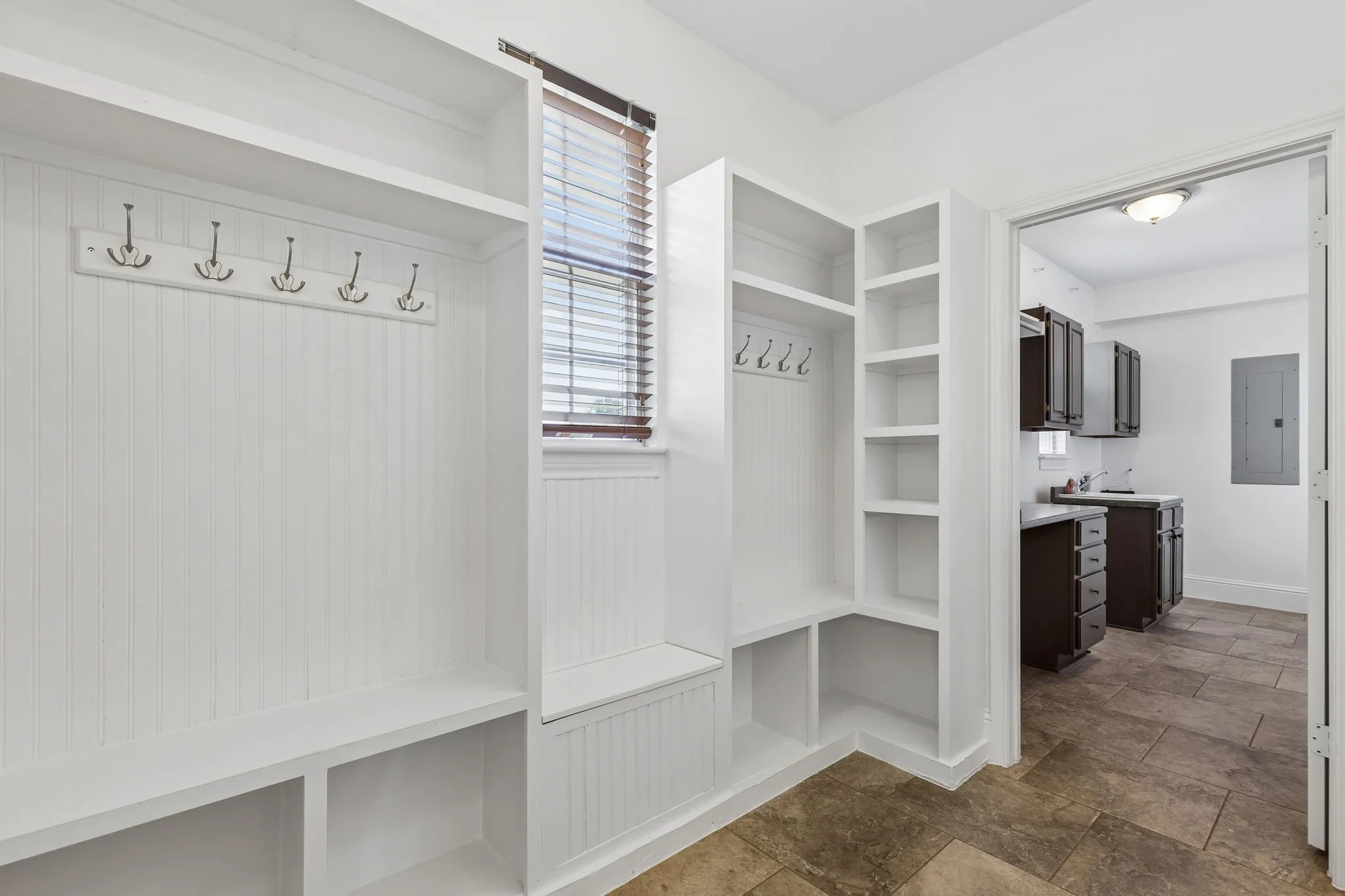 Convenient Mudroom off of the back porch leads to the large laundry room
