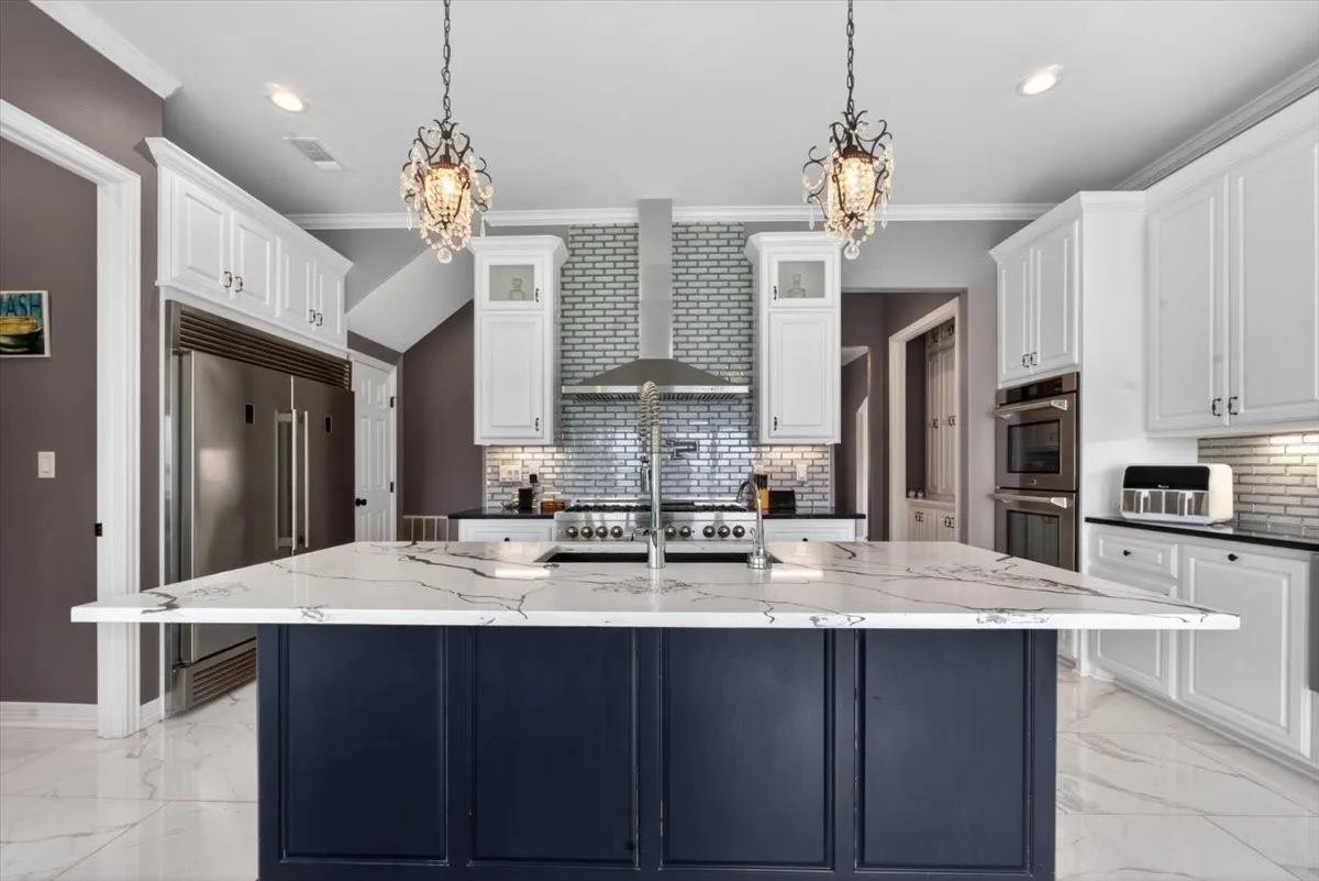 Kitchen with 56" Builtin Refrigerator, 4 Ovens, 6 Burner Gas Stovetop with Griddle, Pot Filler, Instant Cold and Hot Water