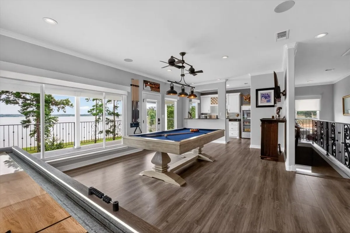Gameroom with Pool Table, Shuffleboard, Mini Kitchen Connected to Covered Balcony with Lake Views