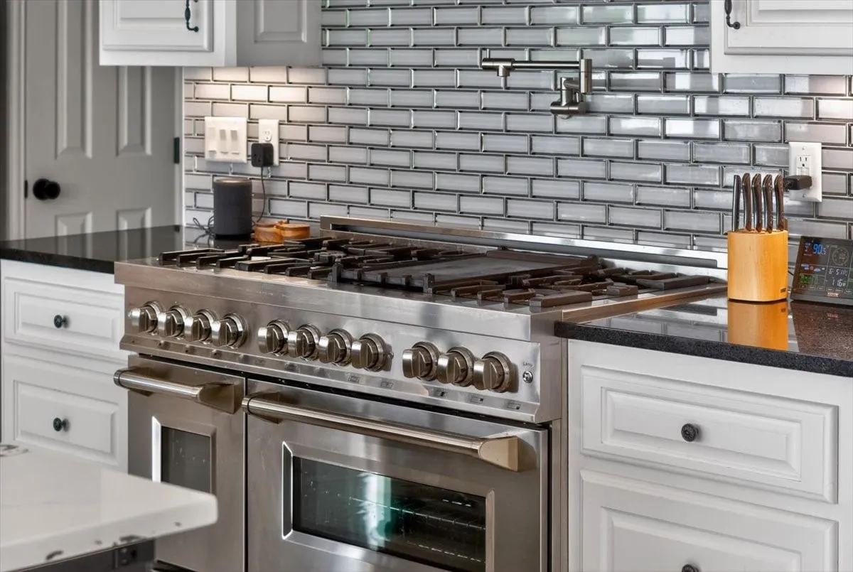 6 Burner Gas Stove plus Griddle, 2 ovens.  (Not pictured is a Double Oven as well)