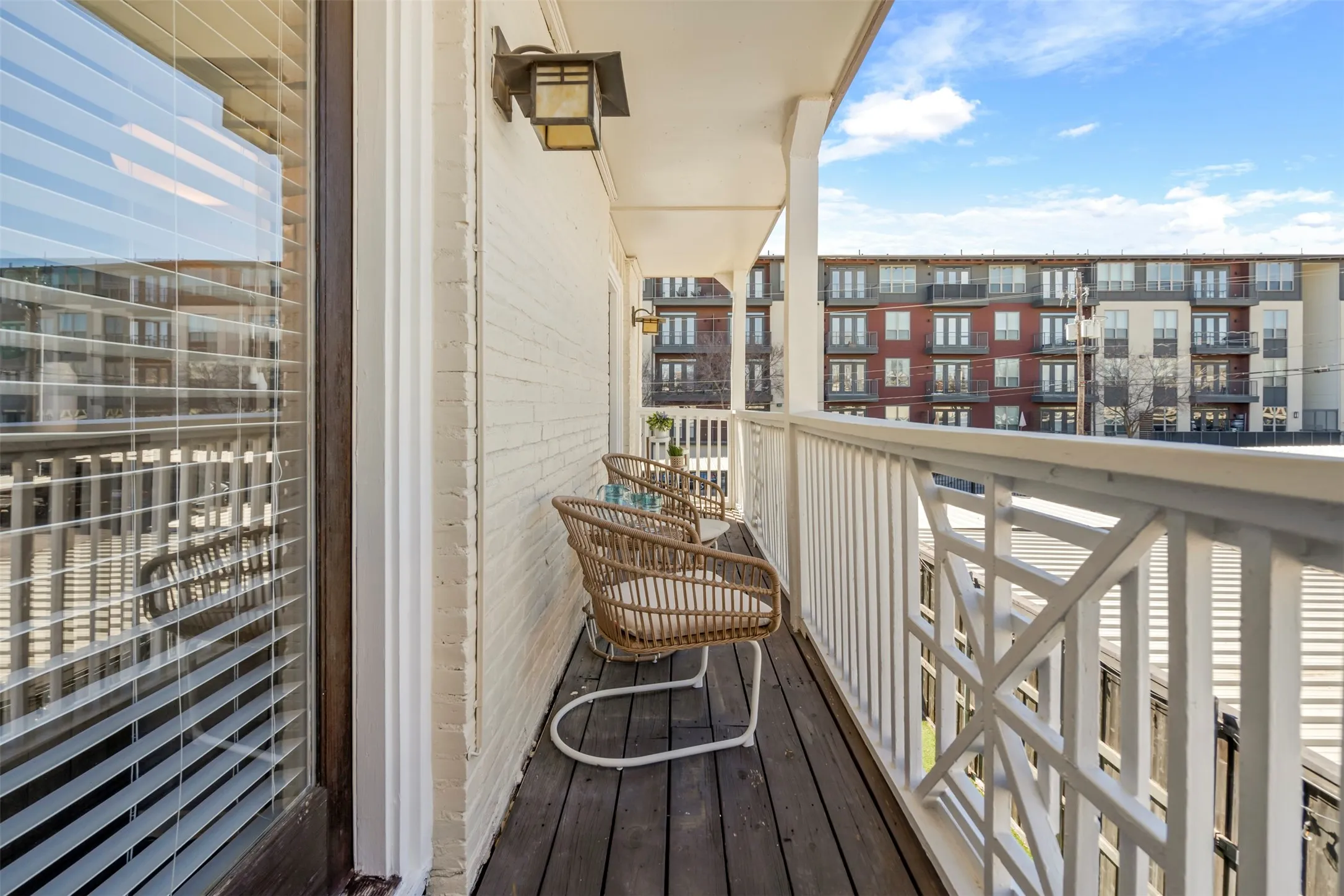 Both the primary bedroom and the guest bedroom have french doors leading to this balcony.