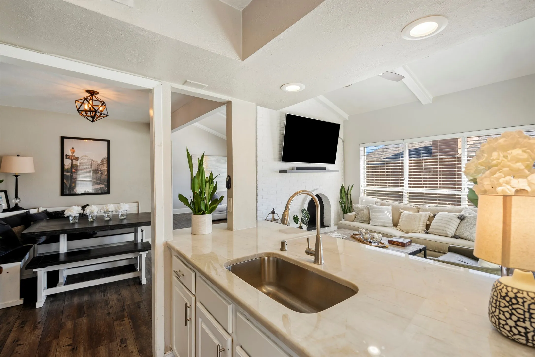 Great shot showing the flow of plan through living areas and kitchen and dining