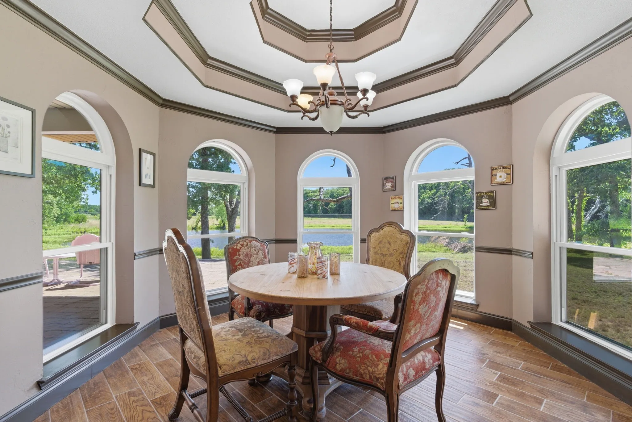 Have morning coffee is this elevated dining area overlooking the back pond.