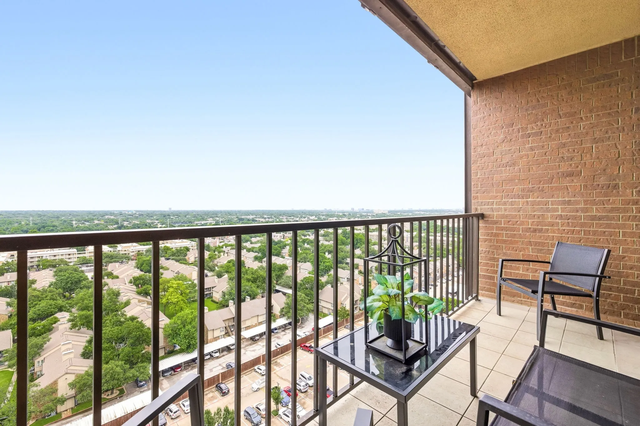 Private balcony featuring a metal railing and tile flooring