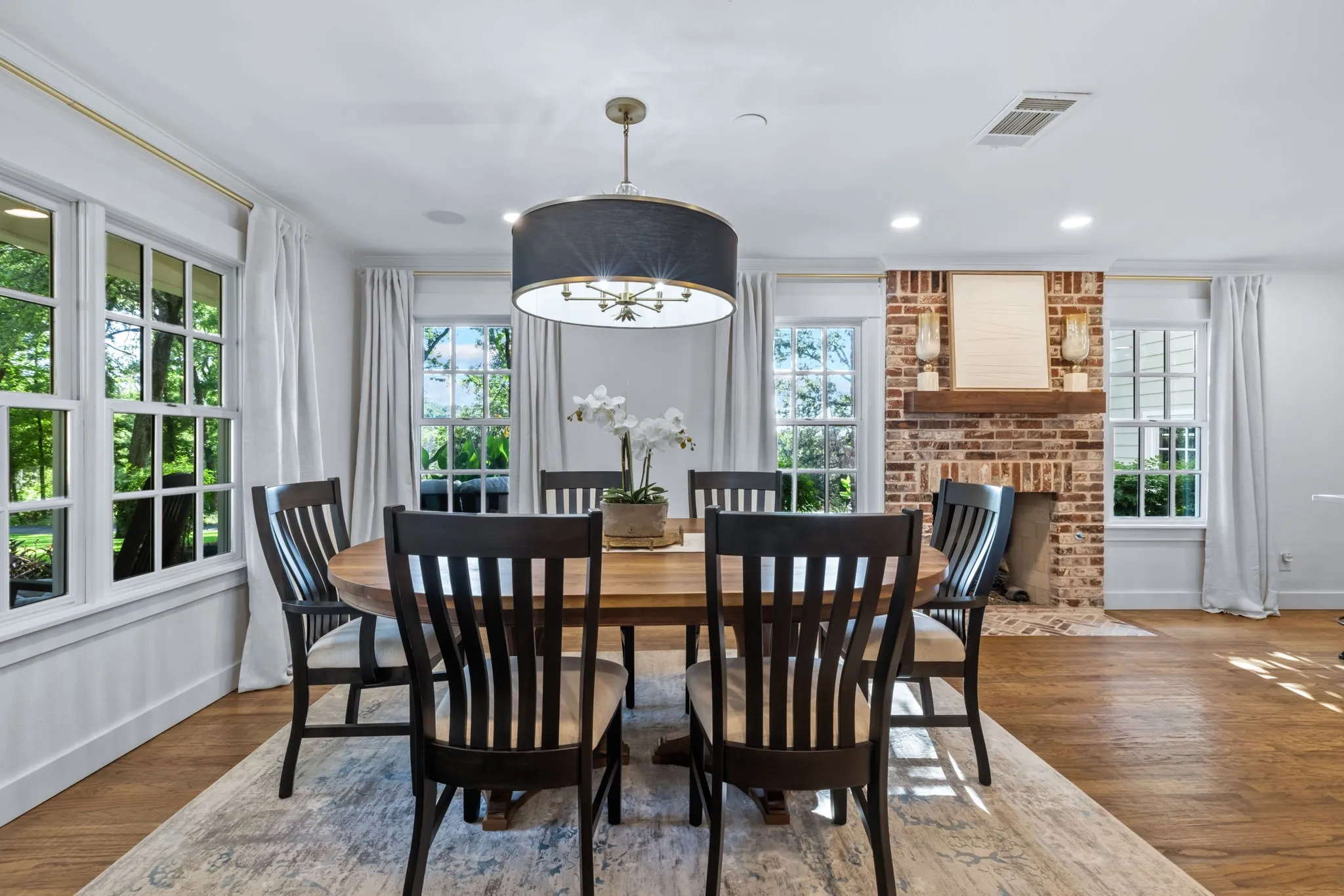 A spacious Dining Area with fireplace adjoins the Kitchen.