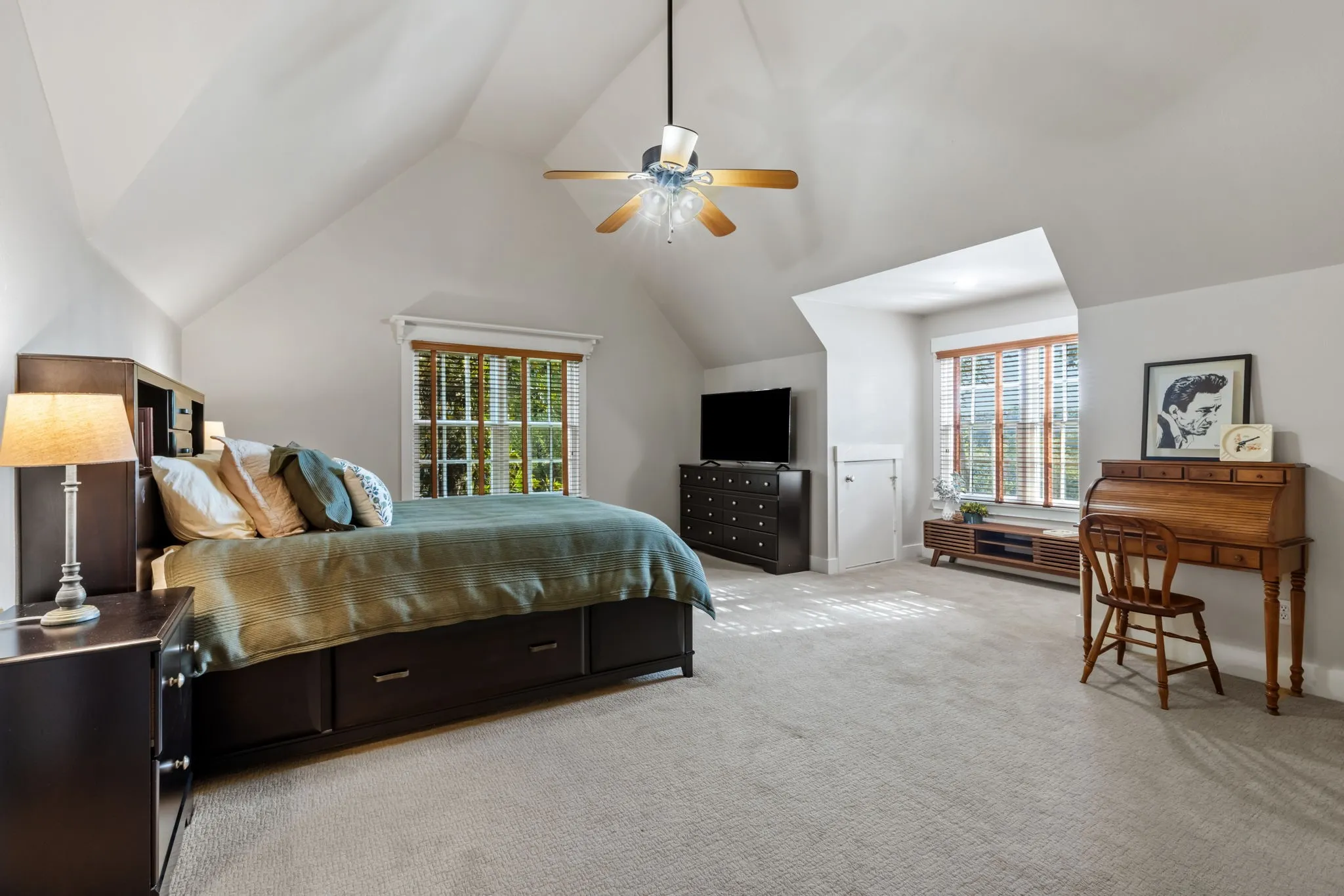 A second primary suite is located upstairs with an ensuite bathroom and large walk-in closet.