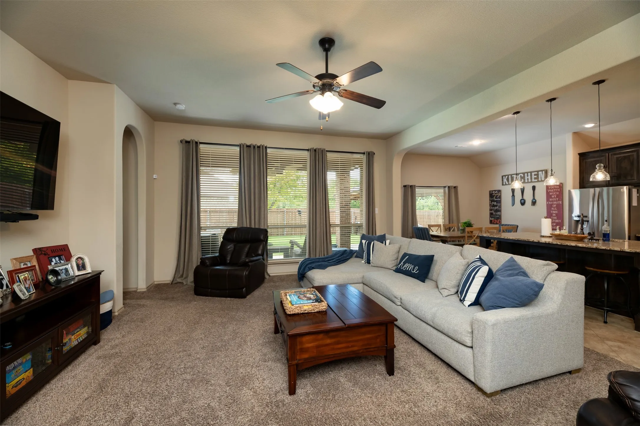 View from living area showing the open floorplan between kitchen, living and breakfast nook dining.