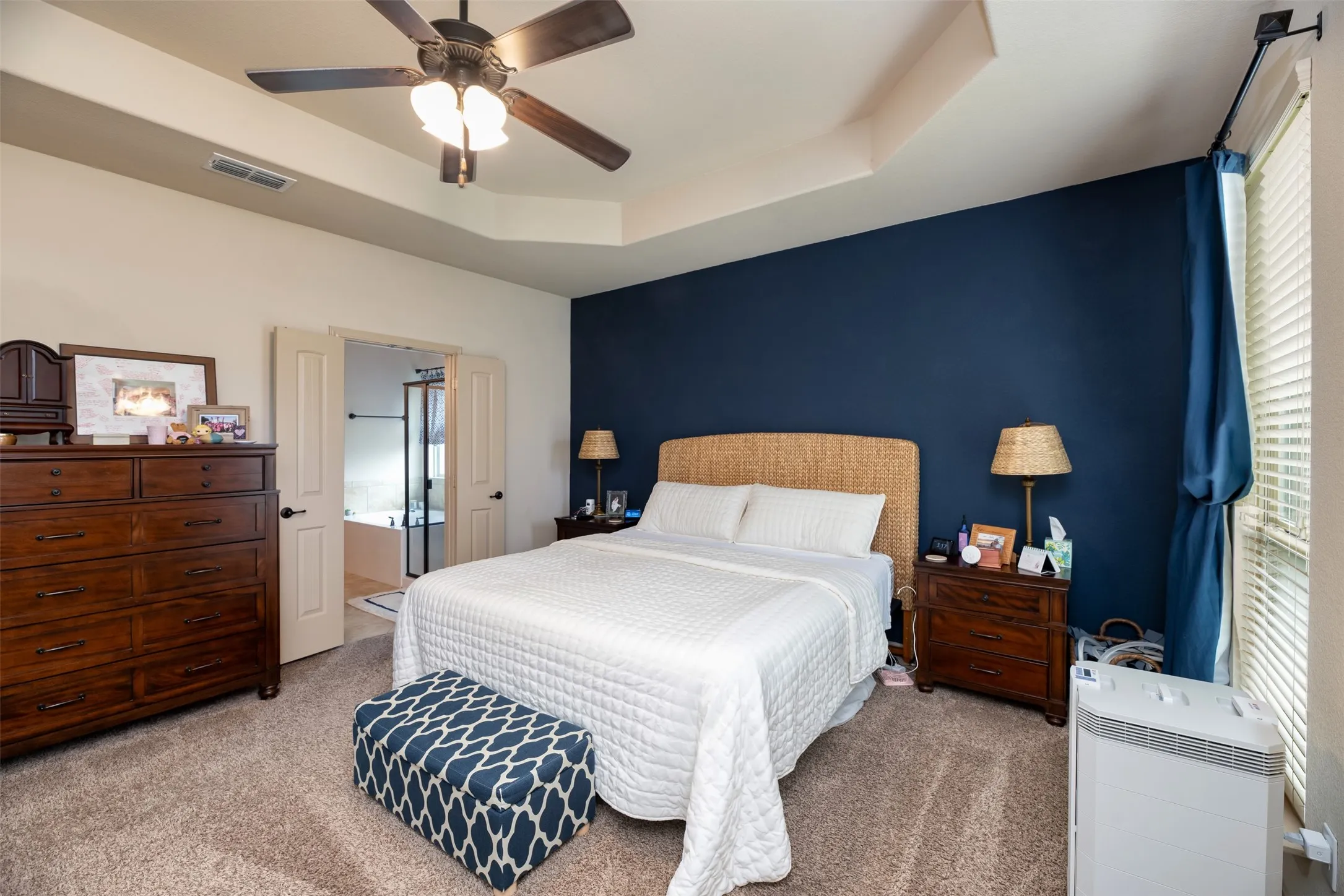 Primary bedroom area with beautiful accent wall
