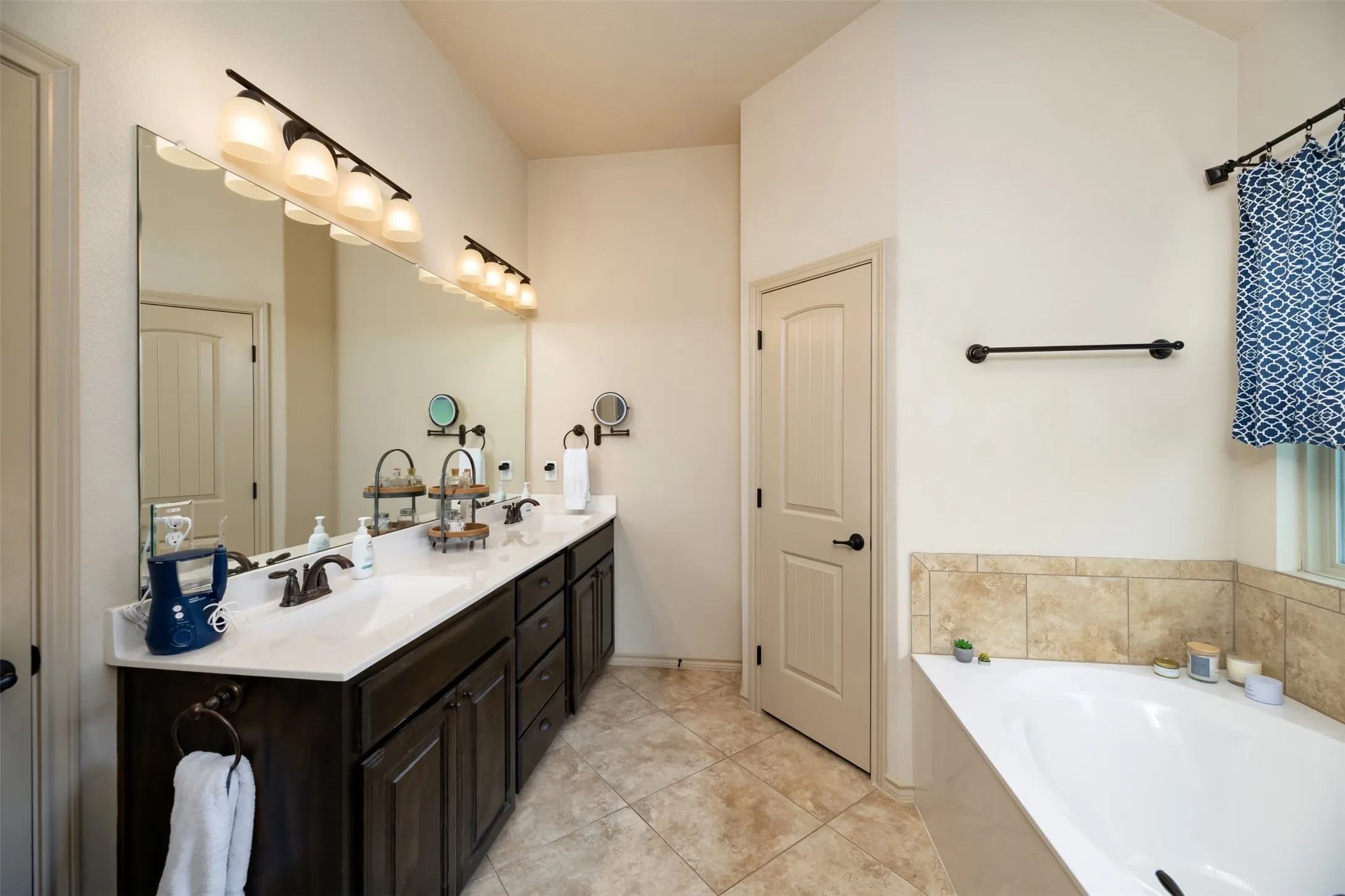 Primary bath with dual vanity sinks, garden tub.