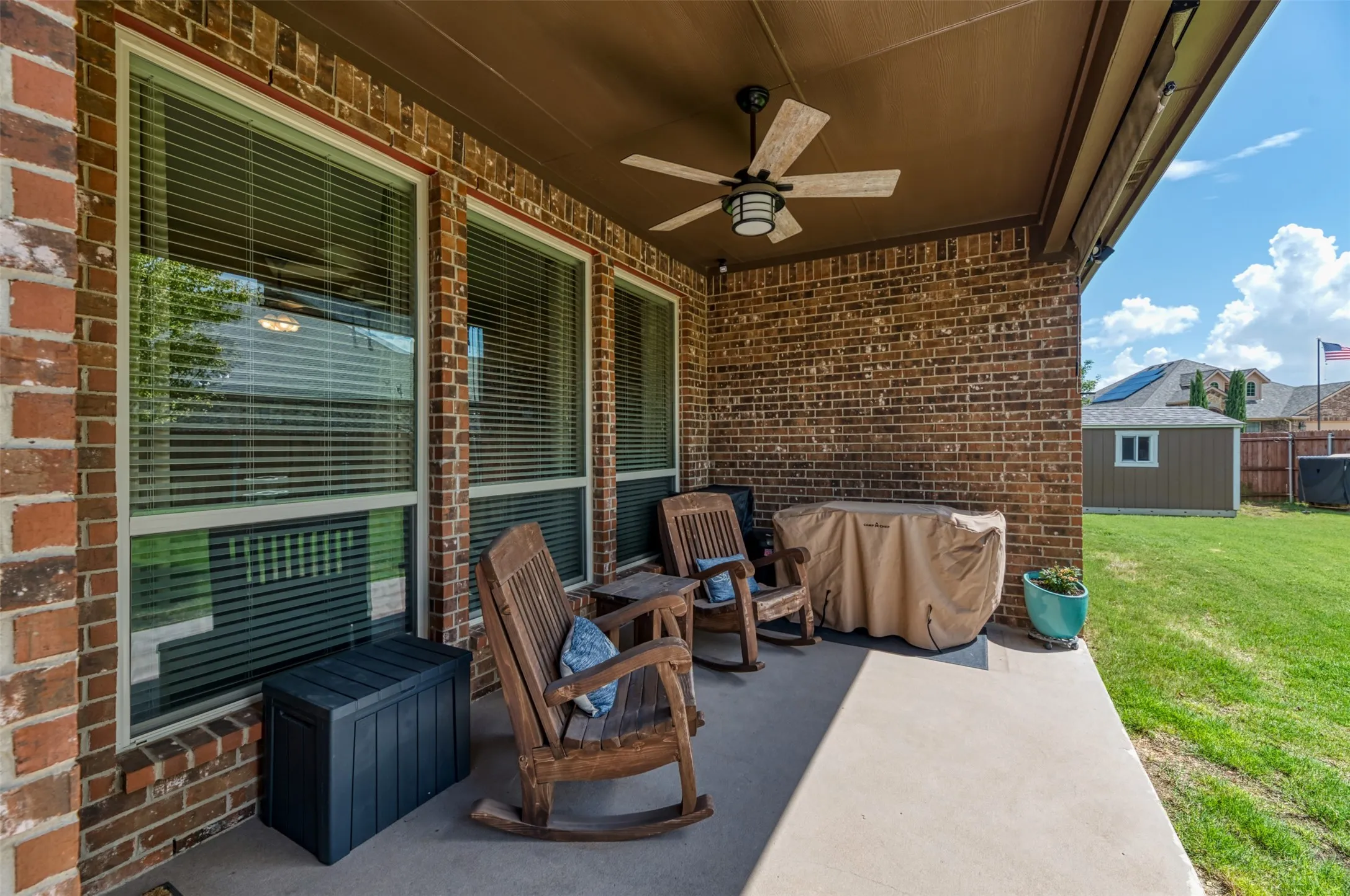 Covered back patio with ceiling fan