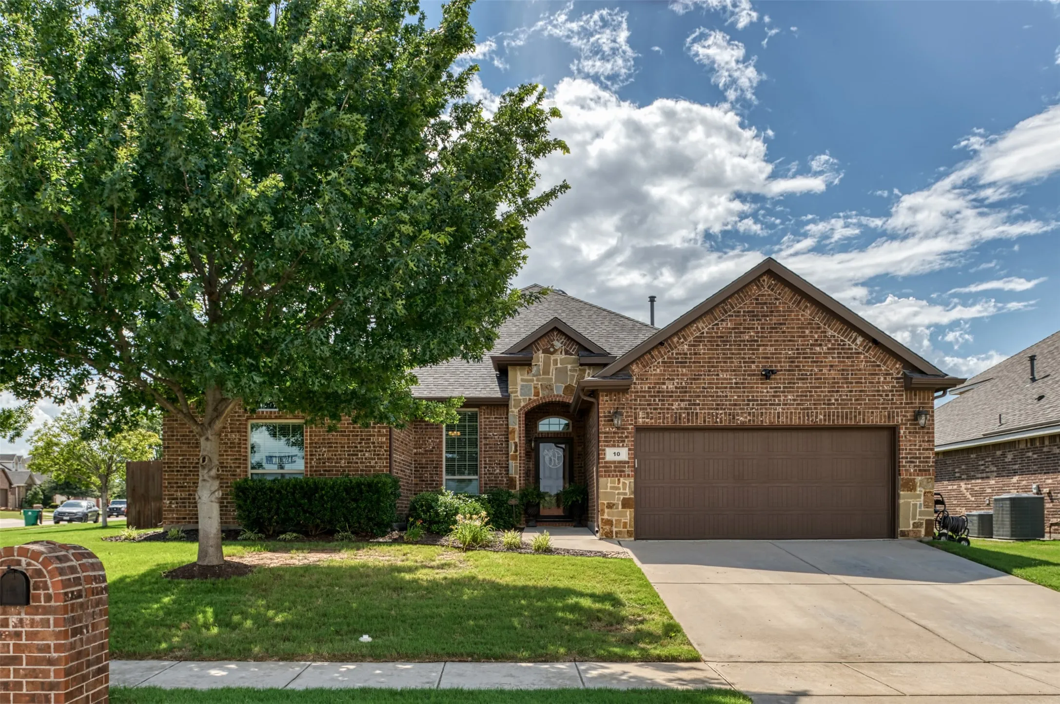 Well maintained landscaping and trees accent this beautiful home!