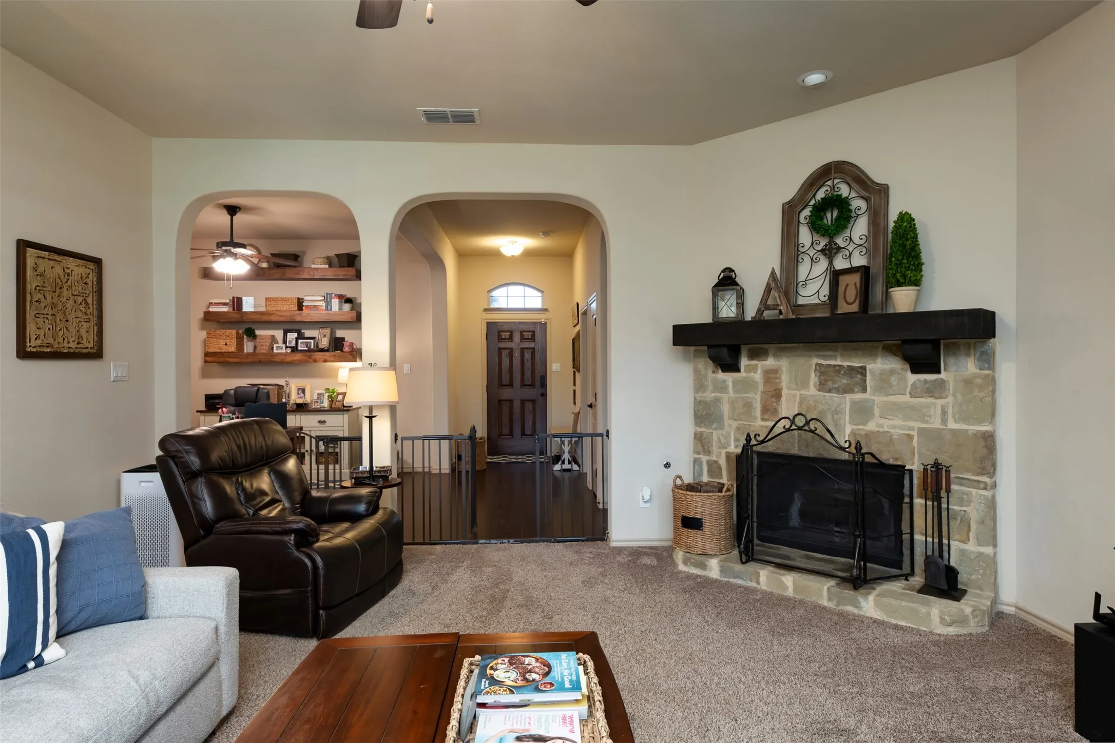 Another view of front entry hallway from living area.  Close up view of FP.