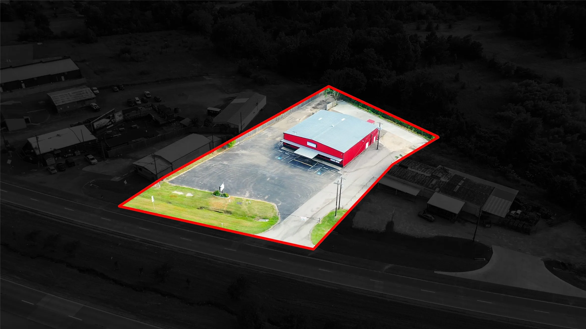 Aerial view of property and surrounding area featuring property parcel outlined