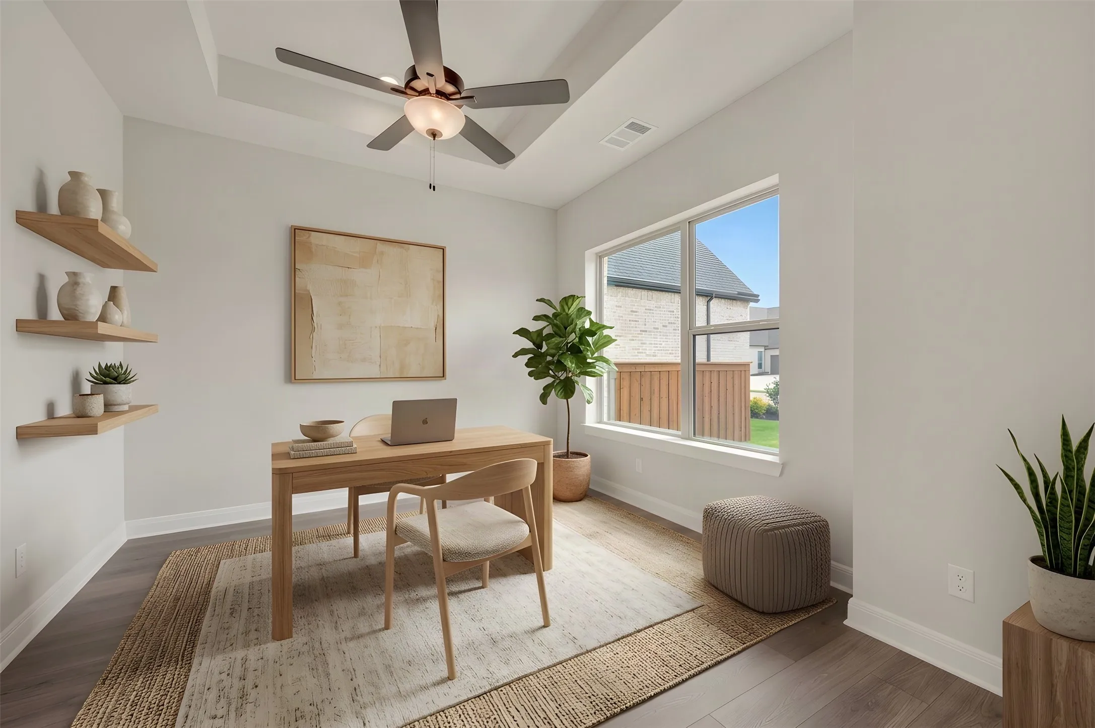Tray ceiling with a ceiling fan, wood-finish flooring, and a large window
