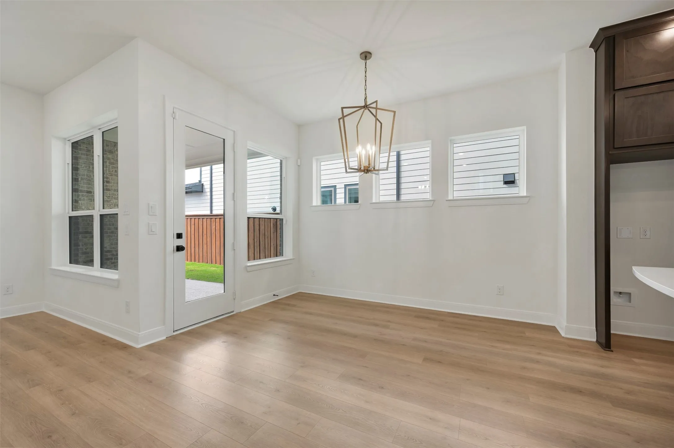 White walls with wood-finish flooring