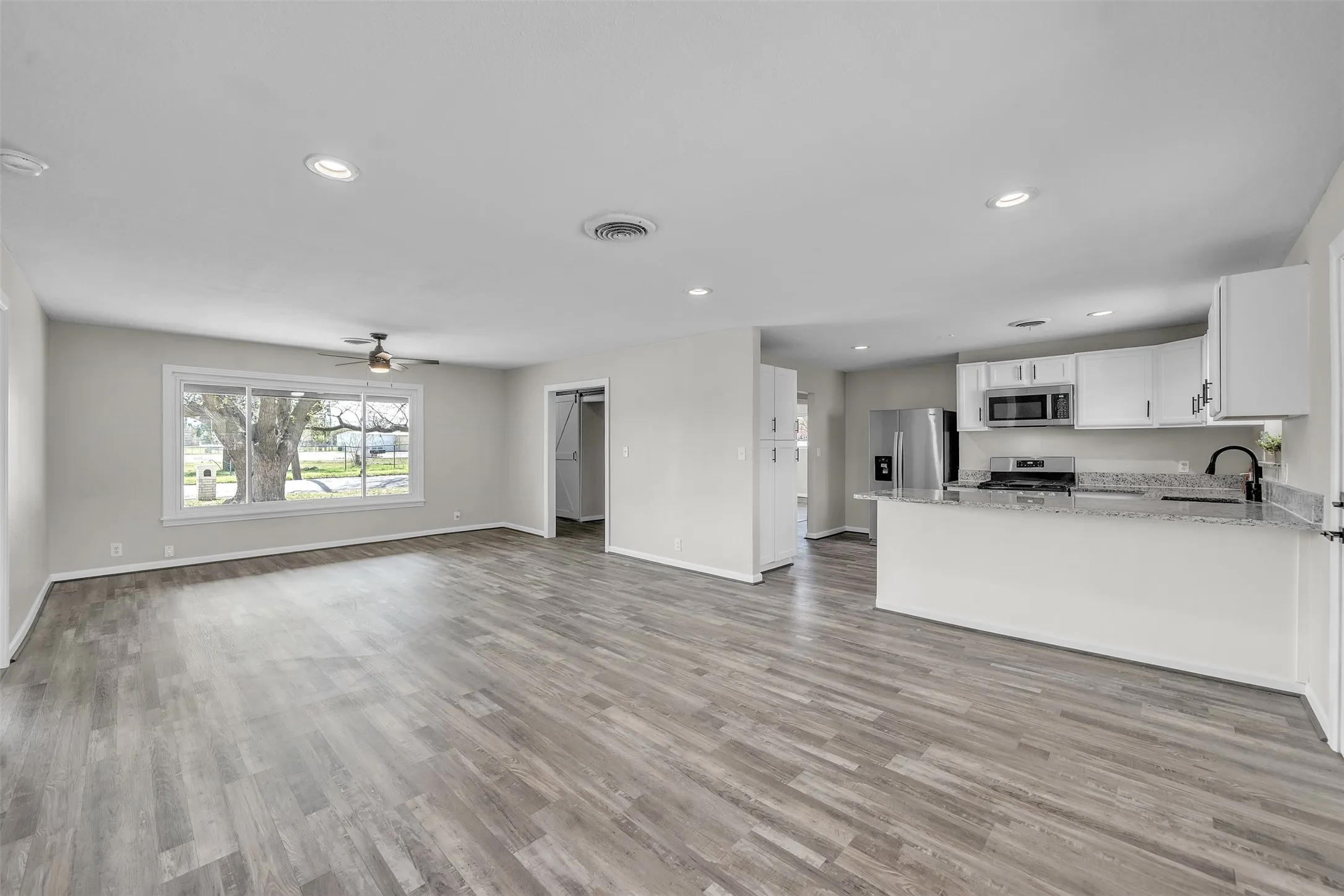 Open interior layout connecting the living spaces and kitchen.