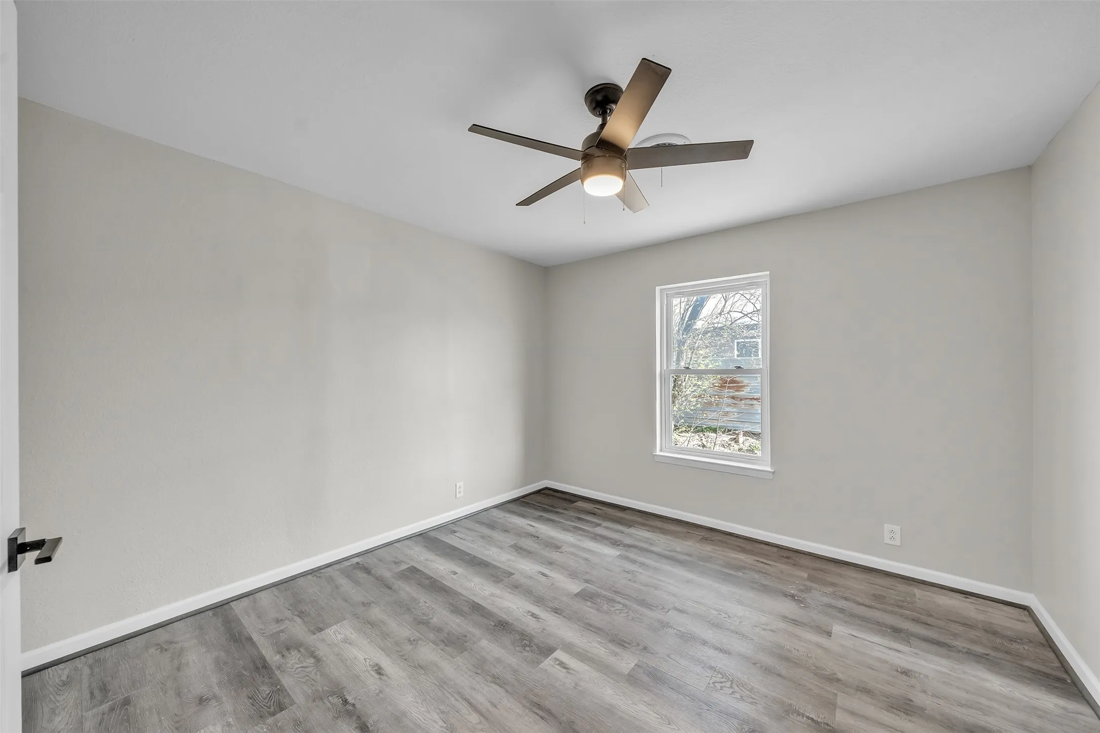Bright secondary bedroom with ample space and a versatile layout.