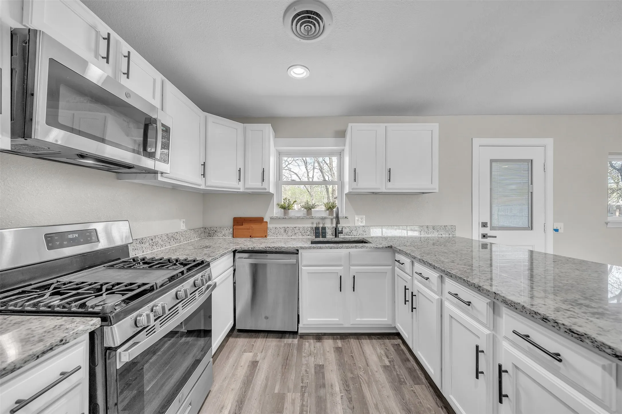 Bowie, TX home with updated kitchen, ample cabinetry and granite countertops.