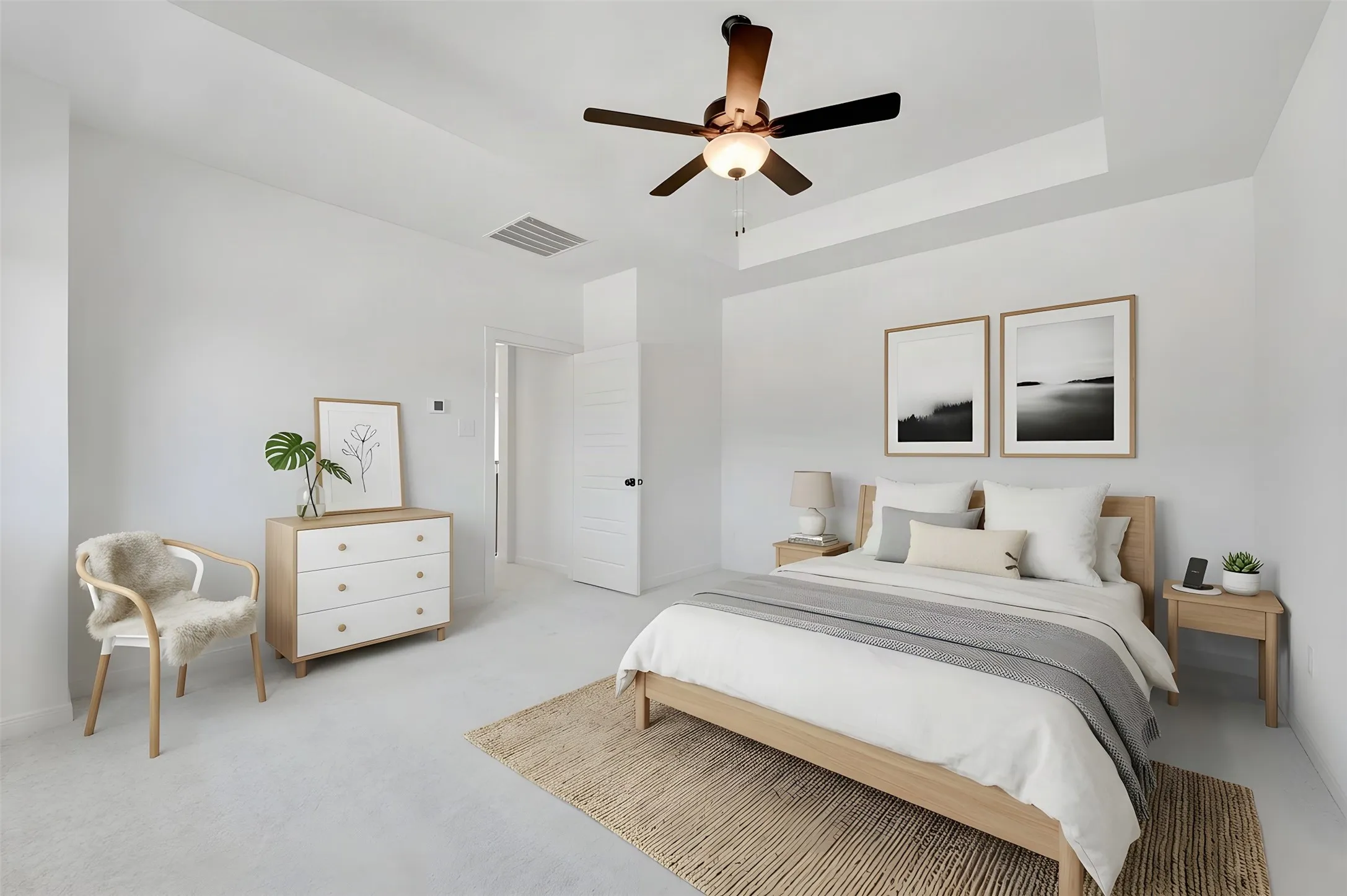 Tray ceiling, ceiling fan with light fixture, light-colored wall-to-wall carpeting, and white paneled door