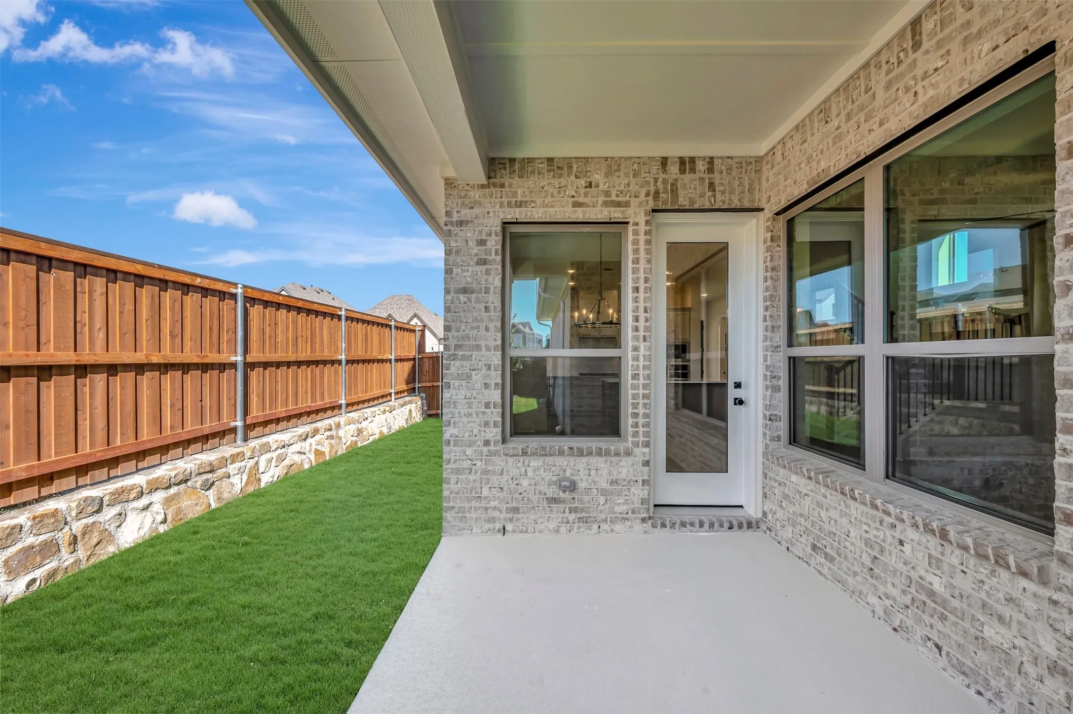 Covered patio with a light gray concrete surface