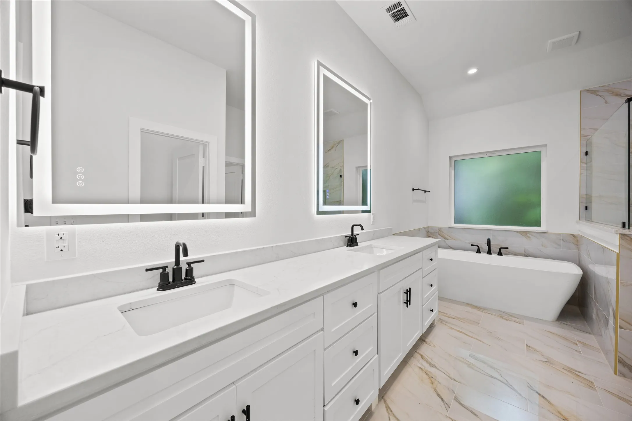 Dual vanity with integrated sinks, quartz countertops, and matte black fixtures