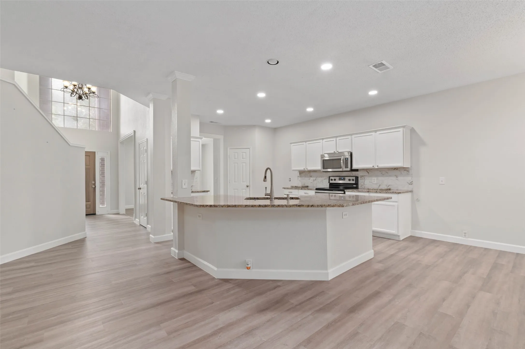 Spacious light and bright kitchen with island and breakfast bar