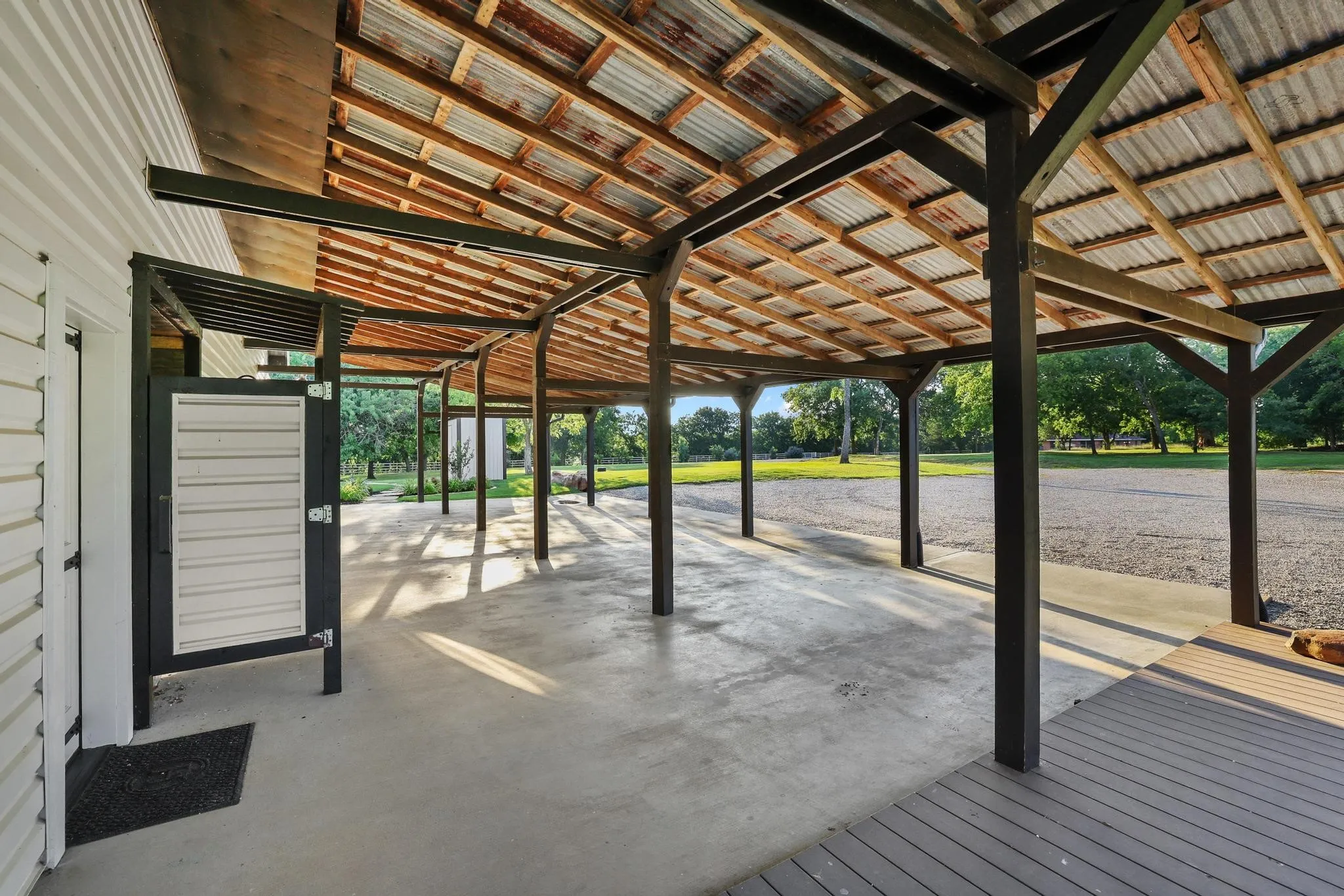 Extensive carport parking and outdoor shower.