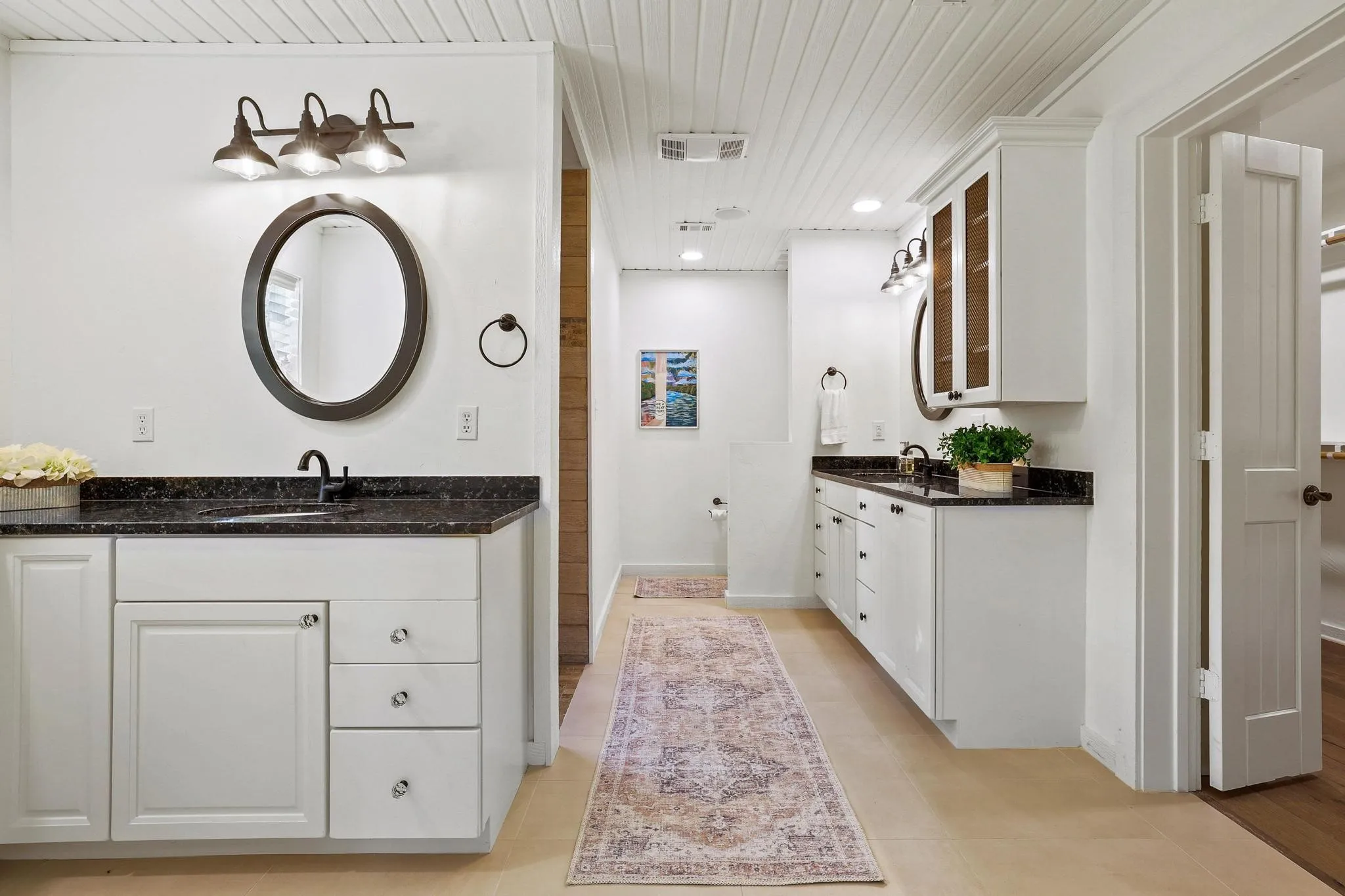 Dual sinks and adjacent walk-in shower.
