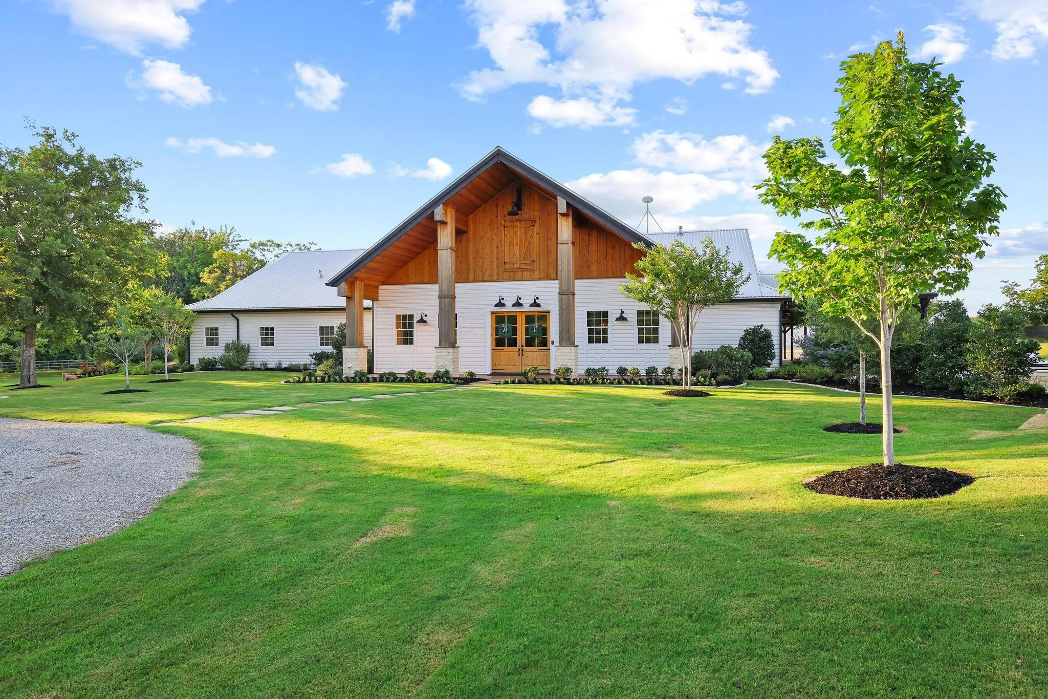 Modern elevated bardominium with pristine landscaping.