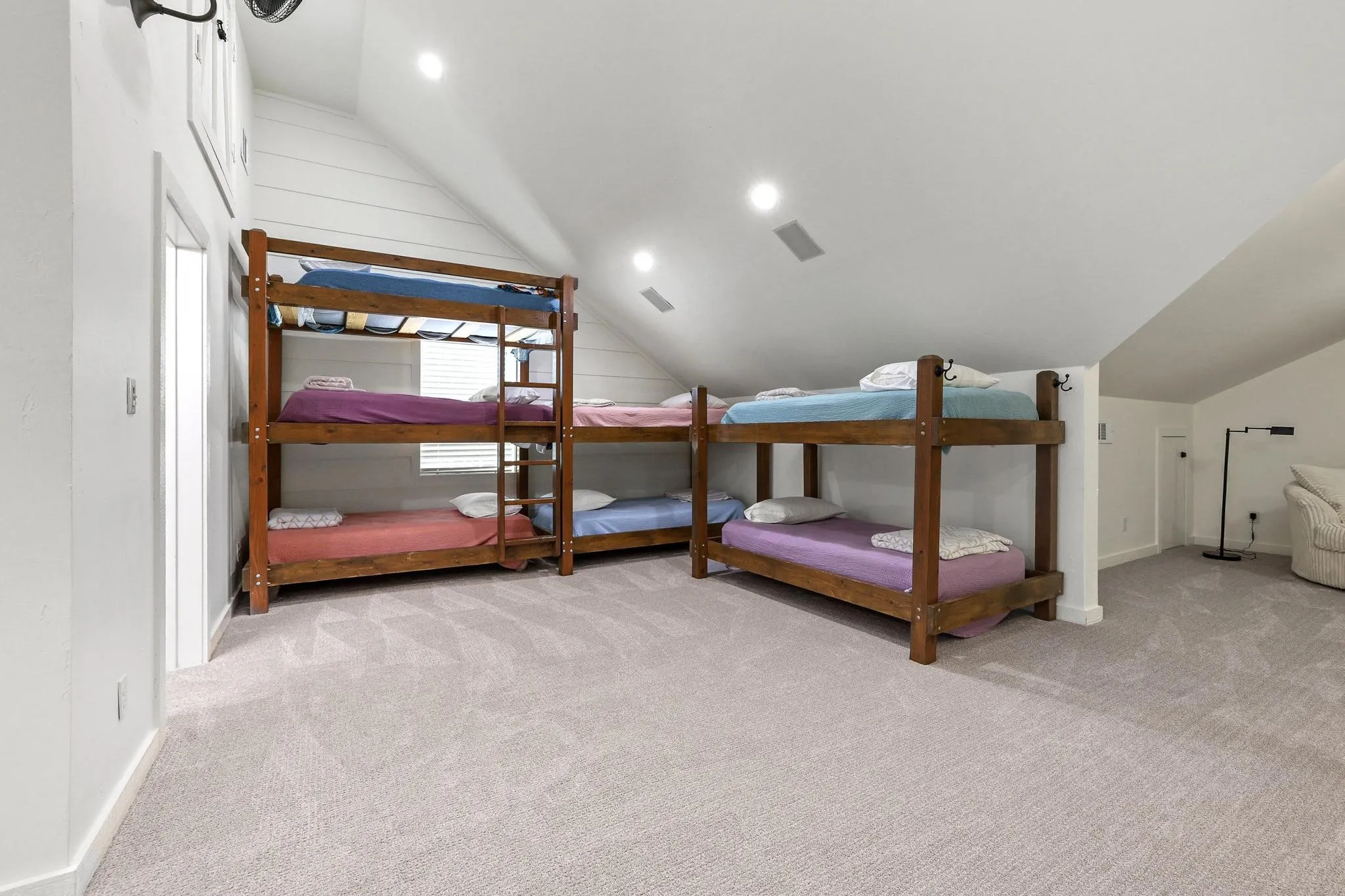 Spacious bunk room on second floor with ensuite bath with dual showers and sinks.
