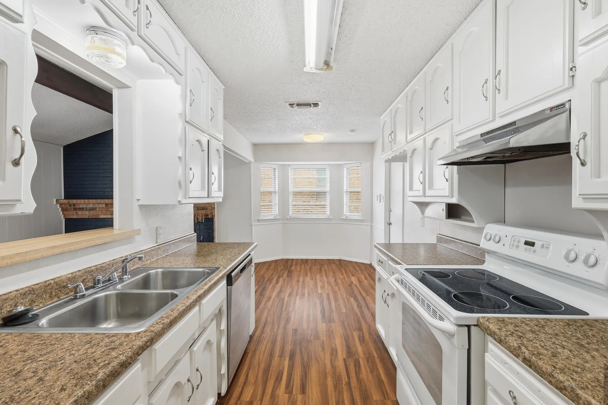 The heart of the home, this spacious kitchen provides ample prep space, abundant storage, and a seamless flow into the sunny breakfast nook.