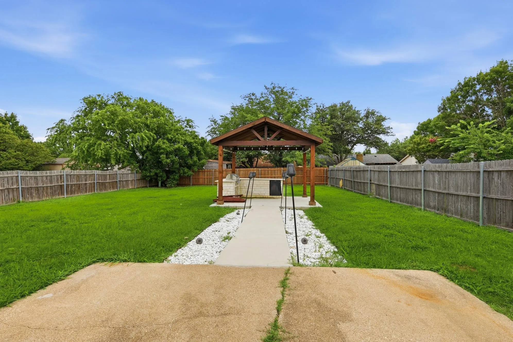 Backyard entertainer's dream with a stunning timber-frame pavilion.