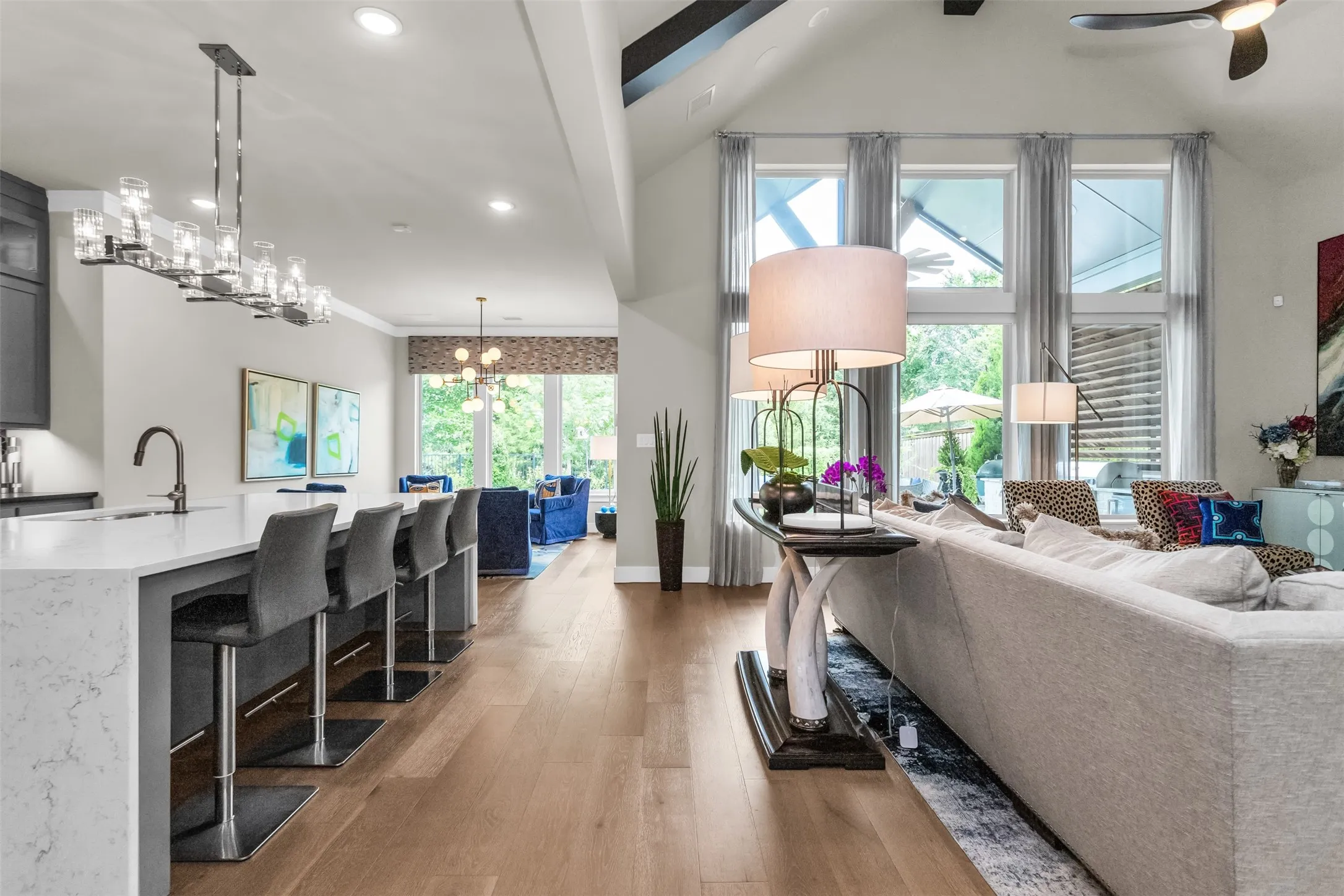Open-concept living space with wood-finish flooring