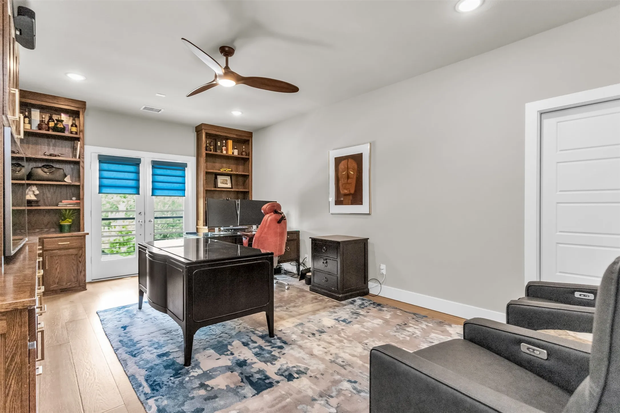 Dedicated space featuring wood-finish flooring, recessed lighting, and a ceiling fan