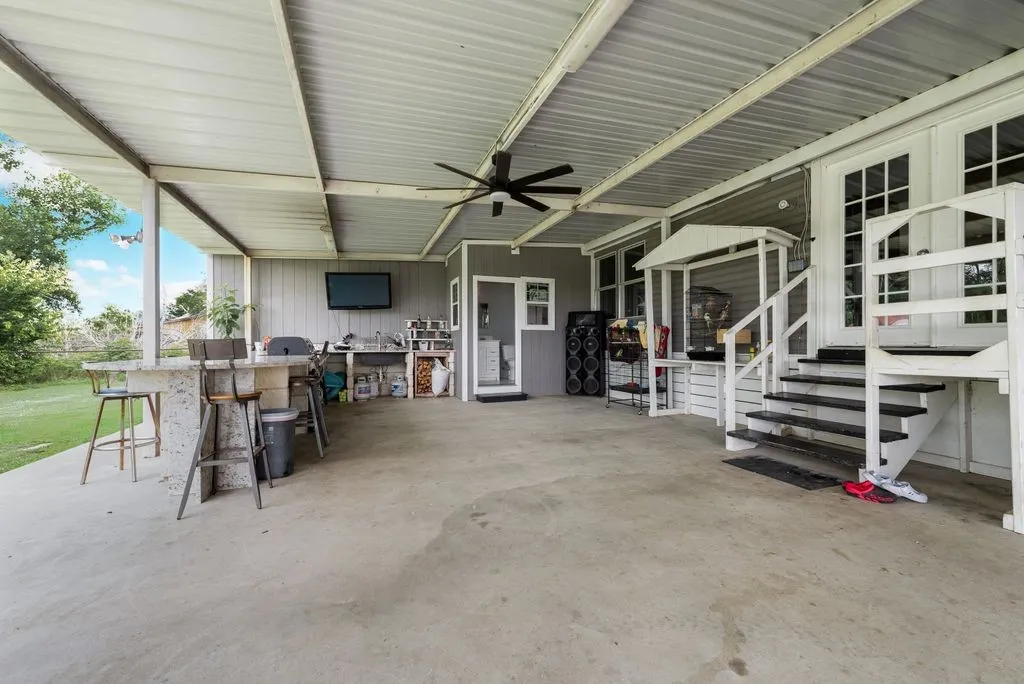 Full outdoor kitchen with full bathroom off the back porch