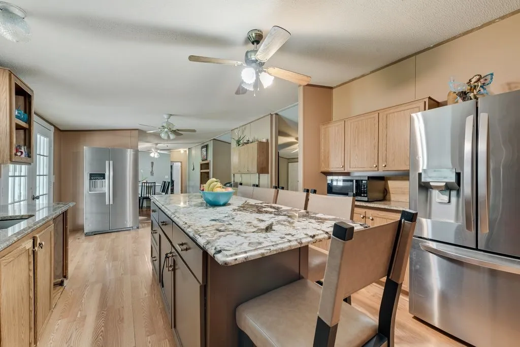 Large kitchen island is the heart of the kitchen