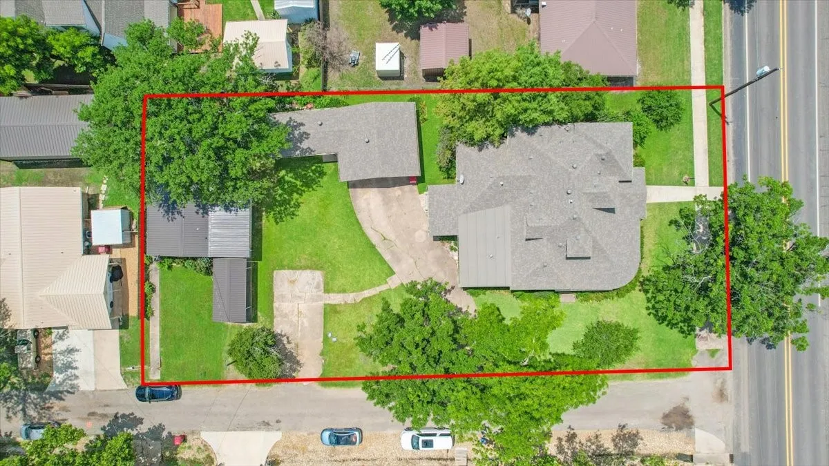 Aerial of primary home, detached garage & secondary home.