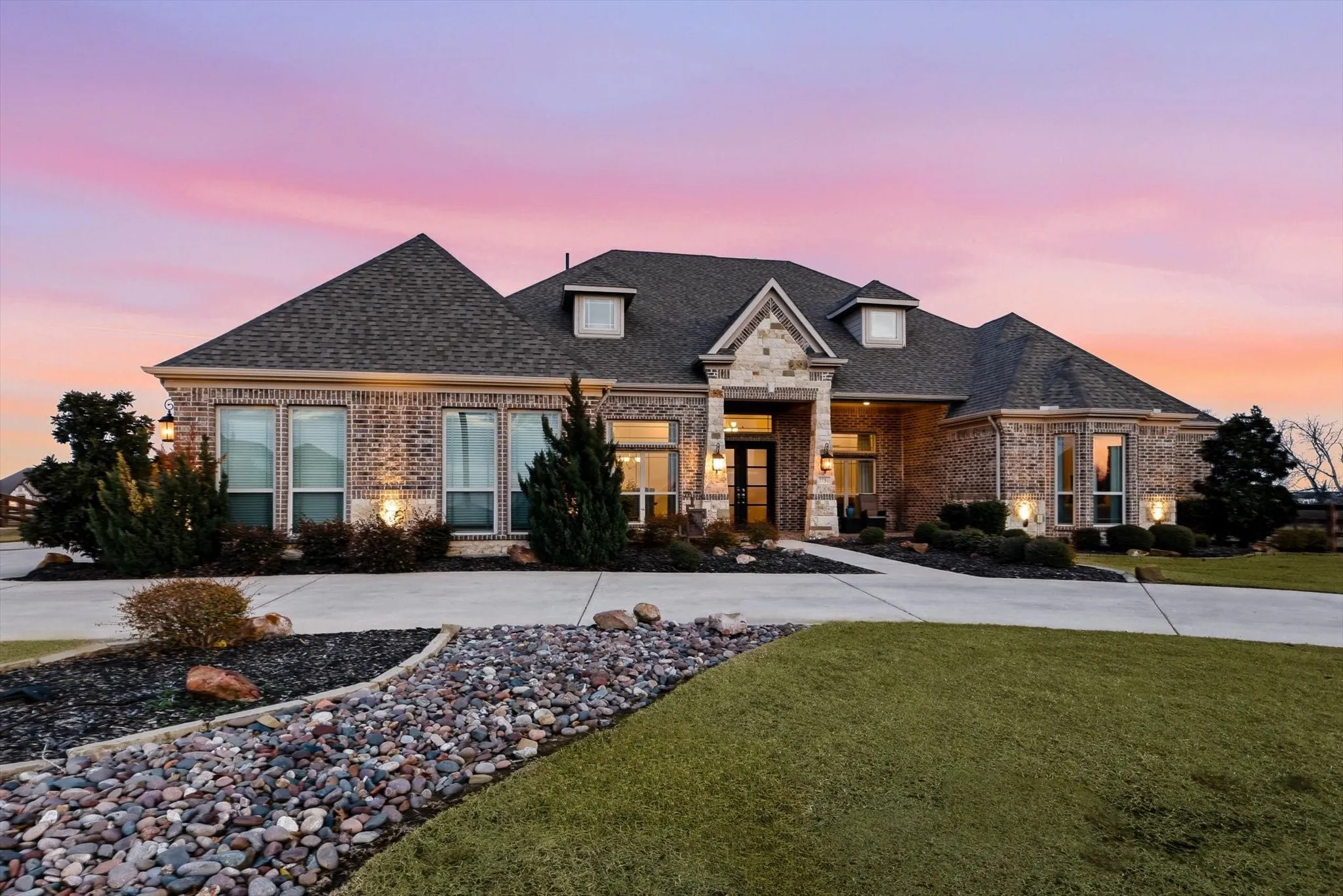 Brick and stone exterior with a prominent gabled entry