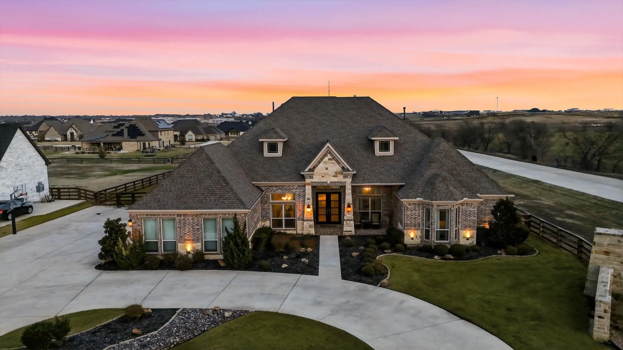 Brick and stone exterior with a multi-gabled roofline