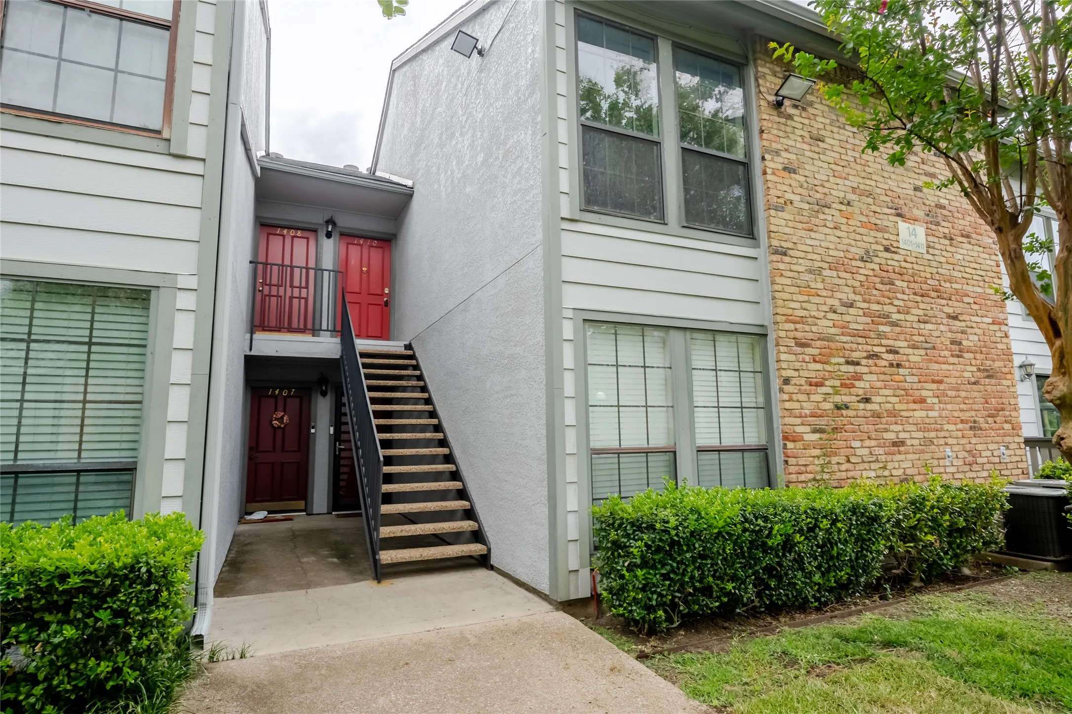 Multi-unit property with a brick and siding exterior