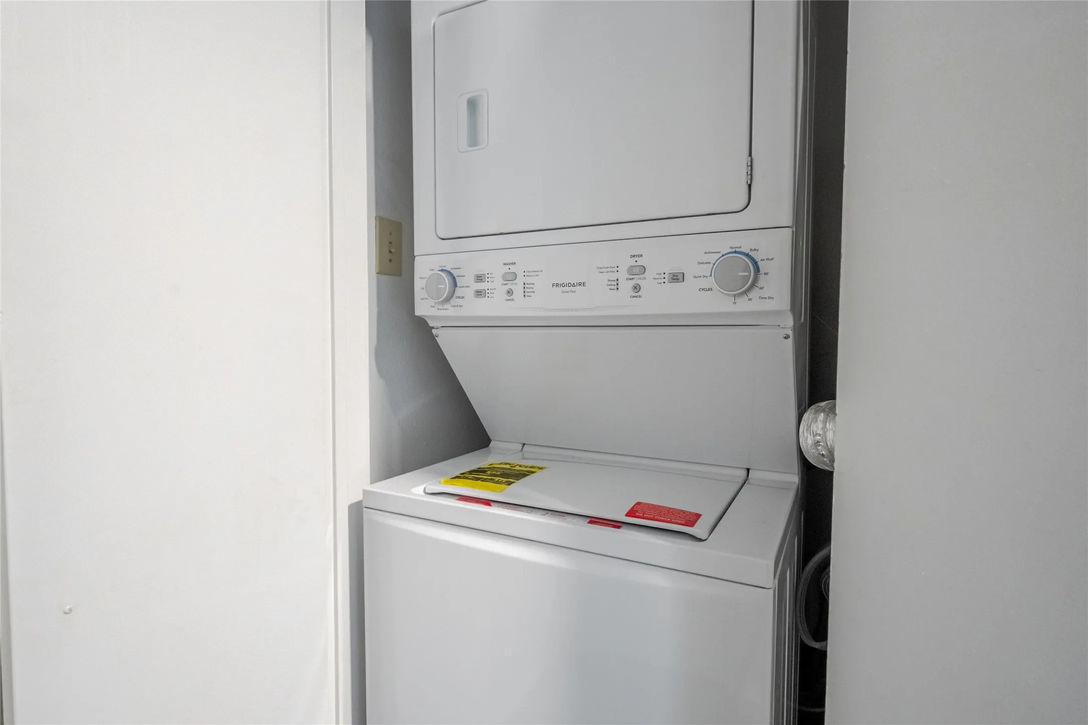 White stackable washer and dryer unit