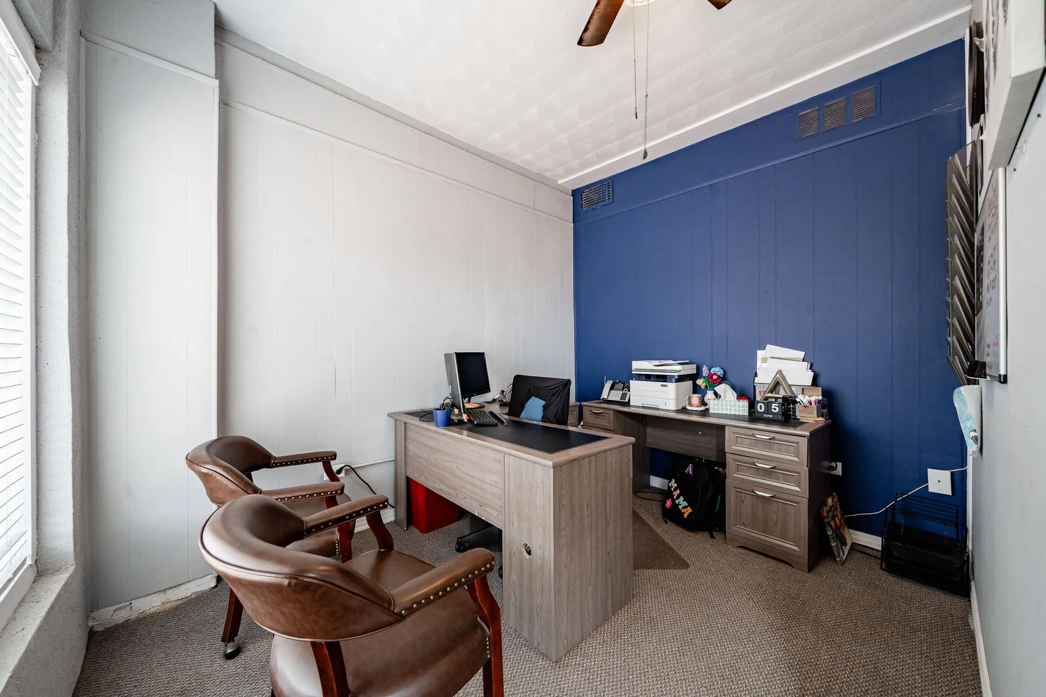 Closed door office at front of building.