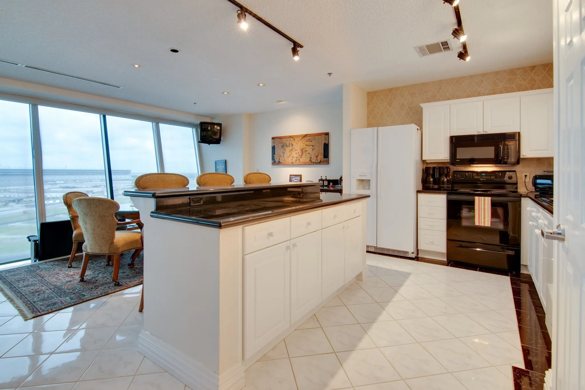 Island provides additional seating and great storage space!