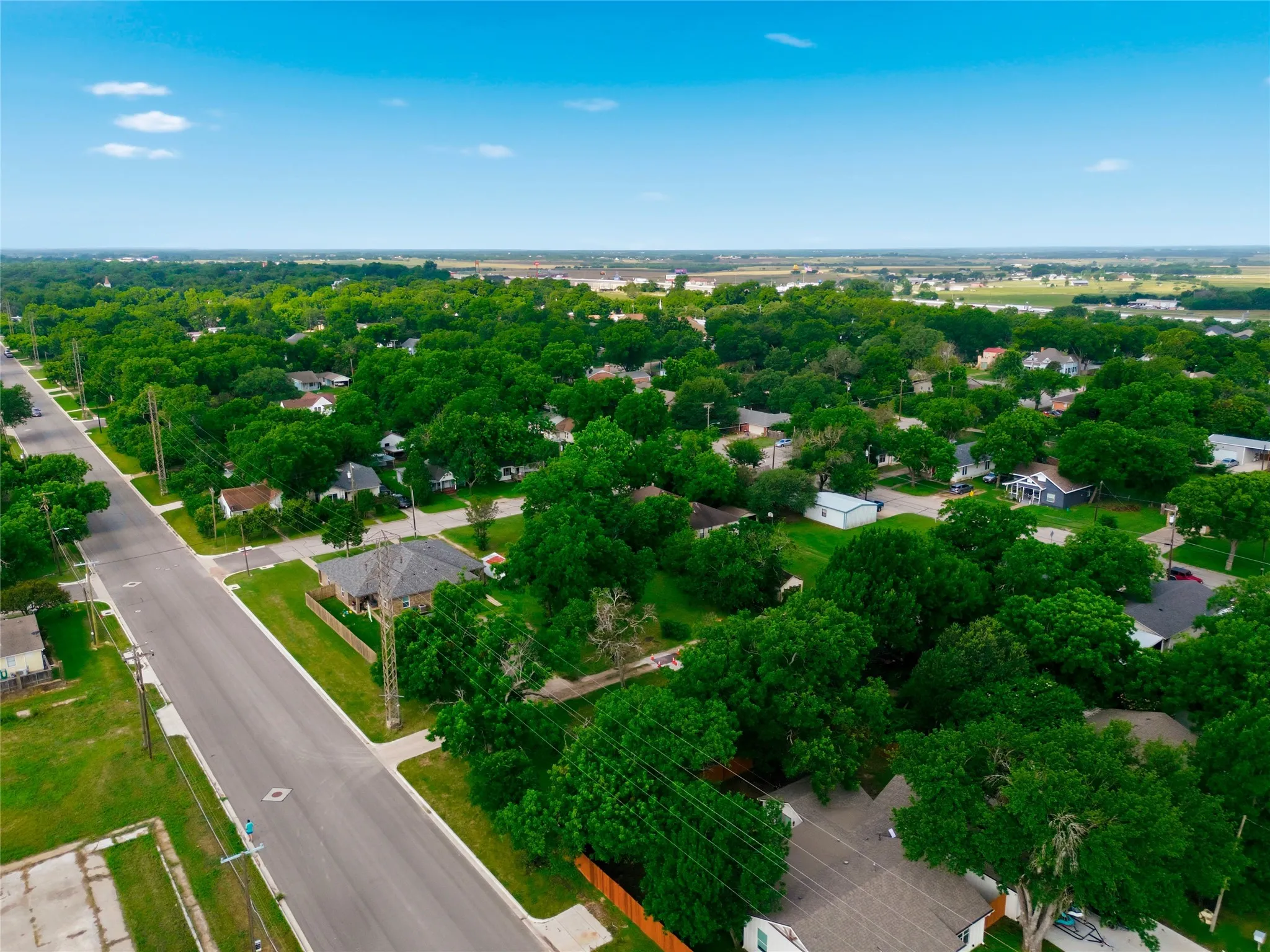 Aerial perspective showcasing a residential area with established greenery
