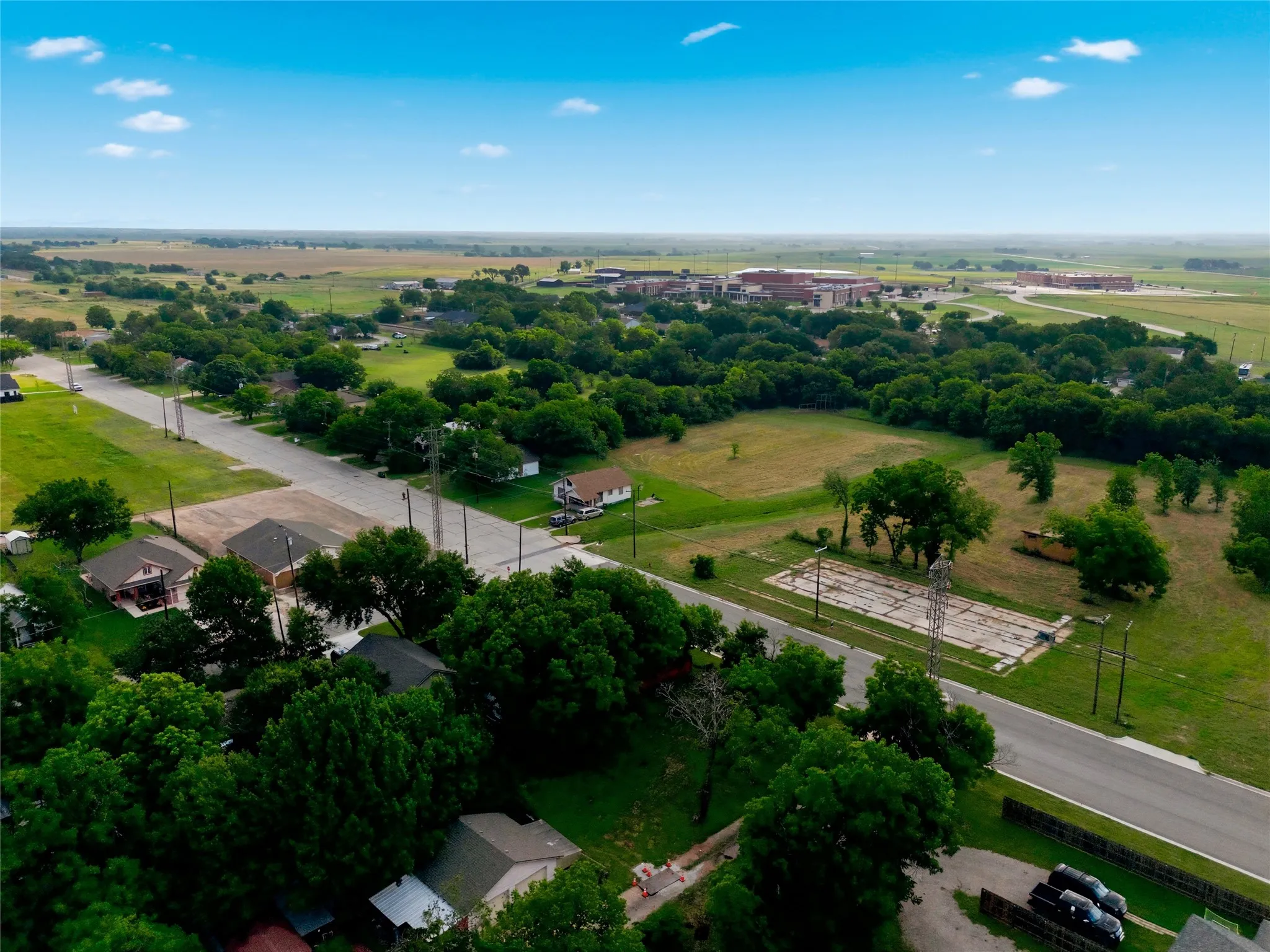 Aerial perspective showcasing a residential area with established tree cover