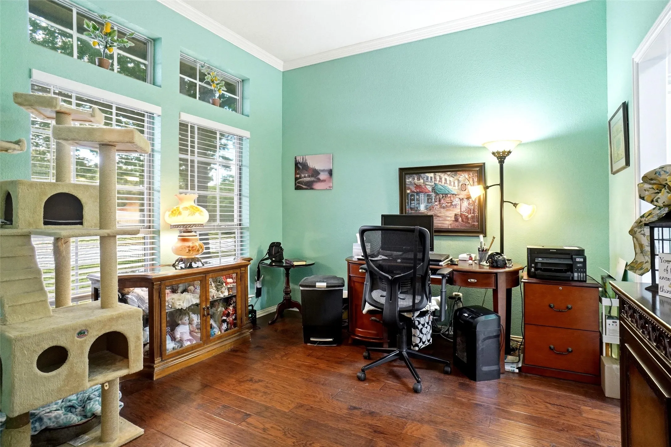 quiet front entry office or 2nd dining or living with engineered wood floor and crown mold at ceiling