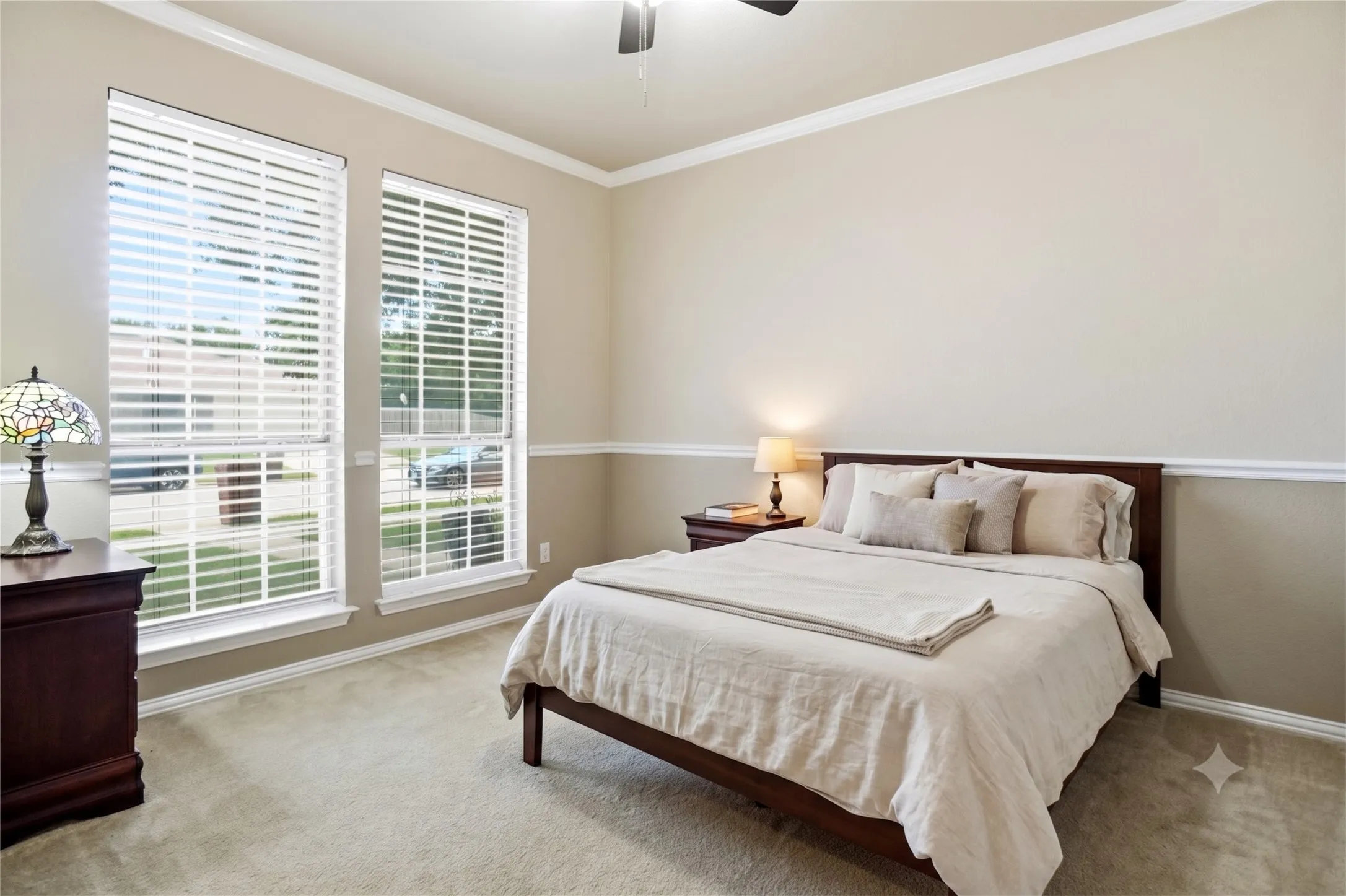 Split front bedroom 2 with full wall closet, crown mold and fan